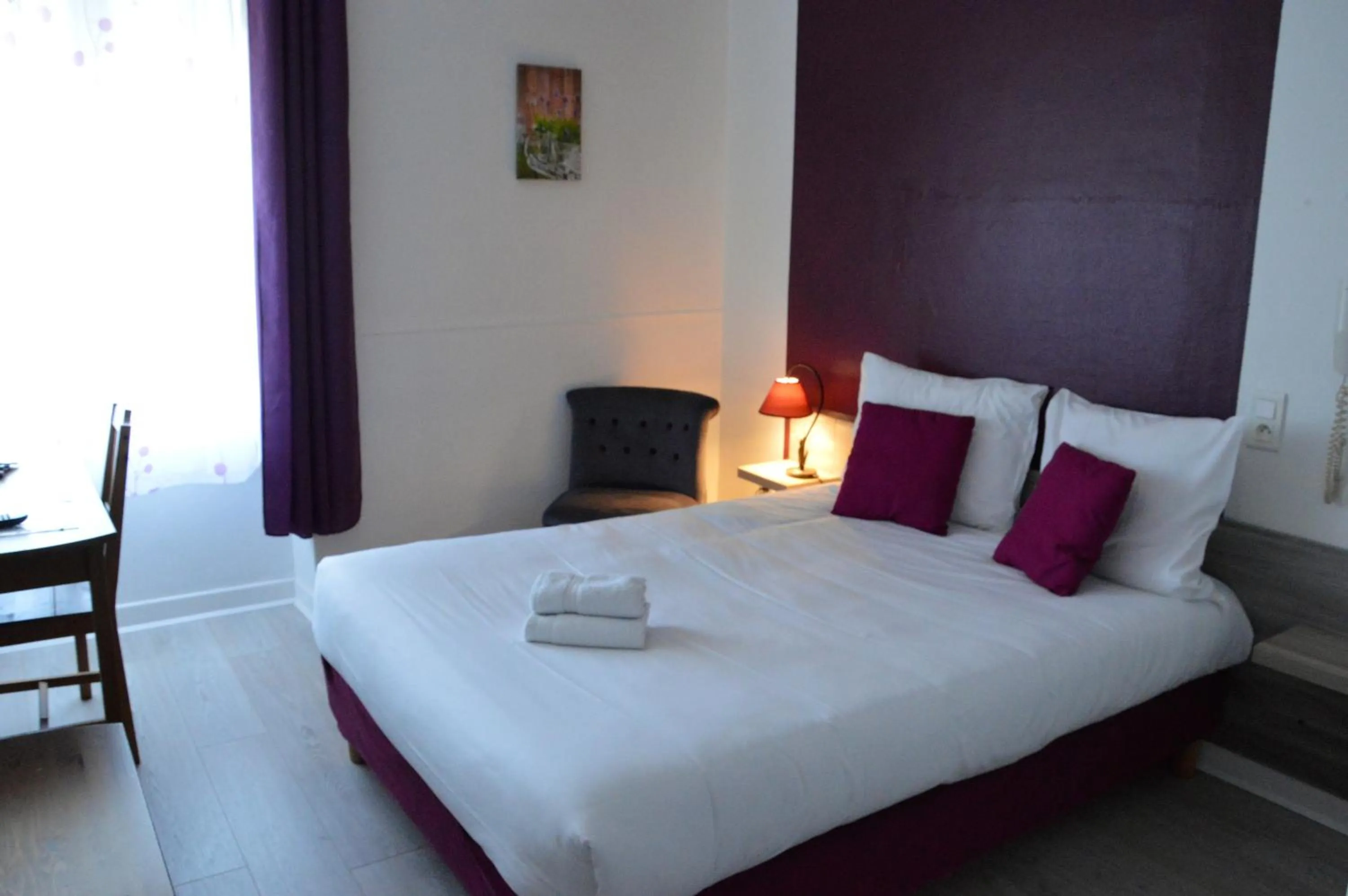 Photo of the whole room, Bed in Hôtel de la Colombière