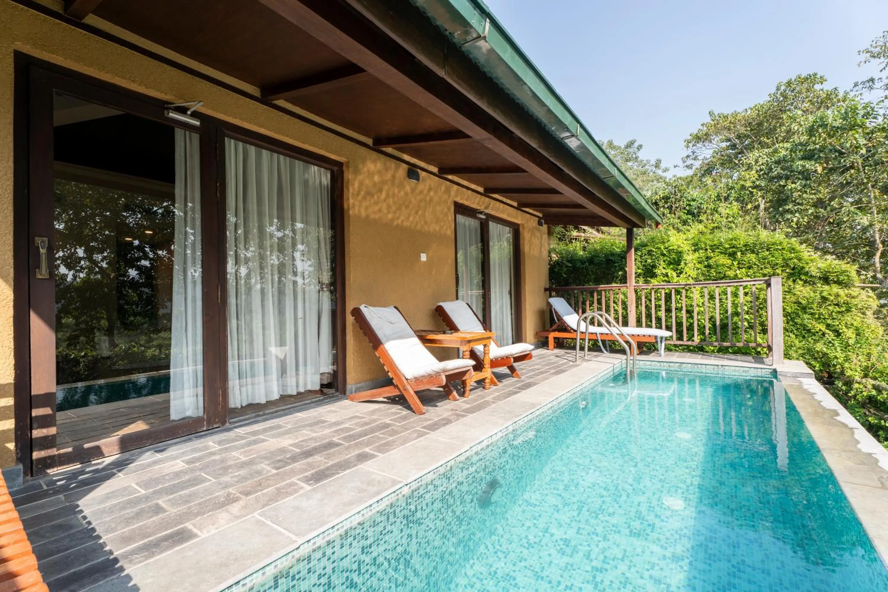 Swimming pool in Jungle Villa Resort - Near Chitwan National Park