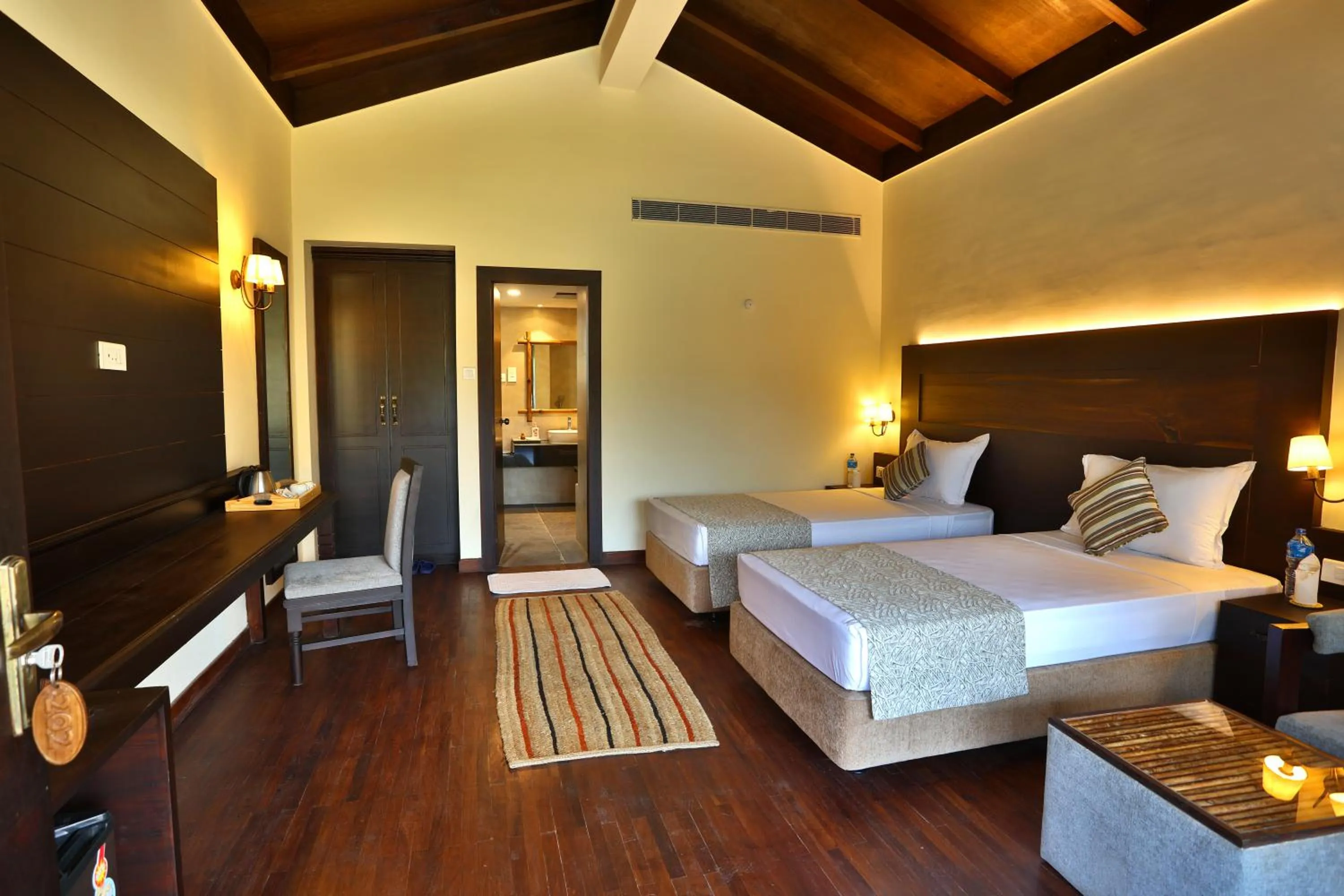 Bedroom, Bed in Jungle Villa Resort - Near Chitwan National Park