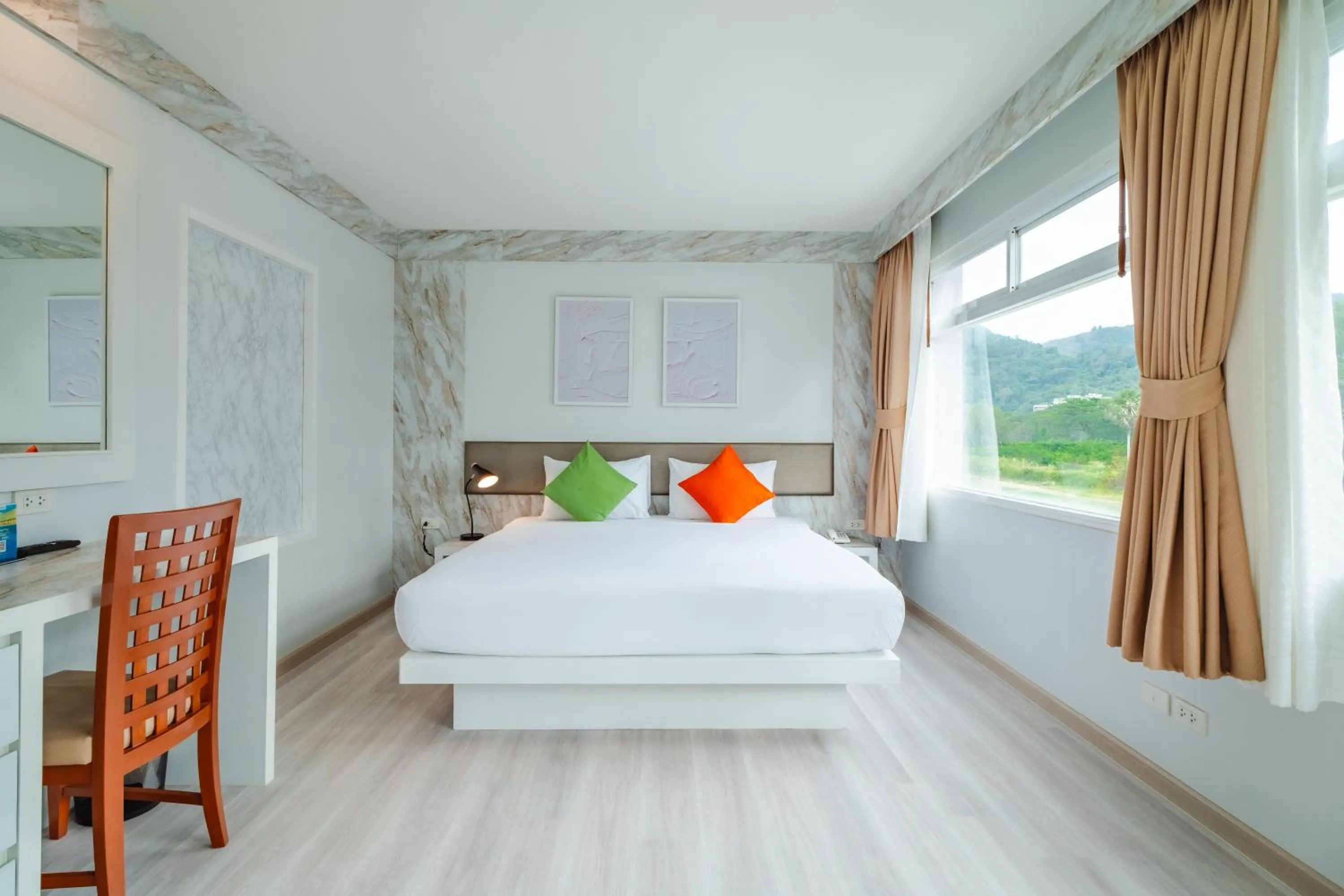 Bed in Baumancasa Beach Resort