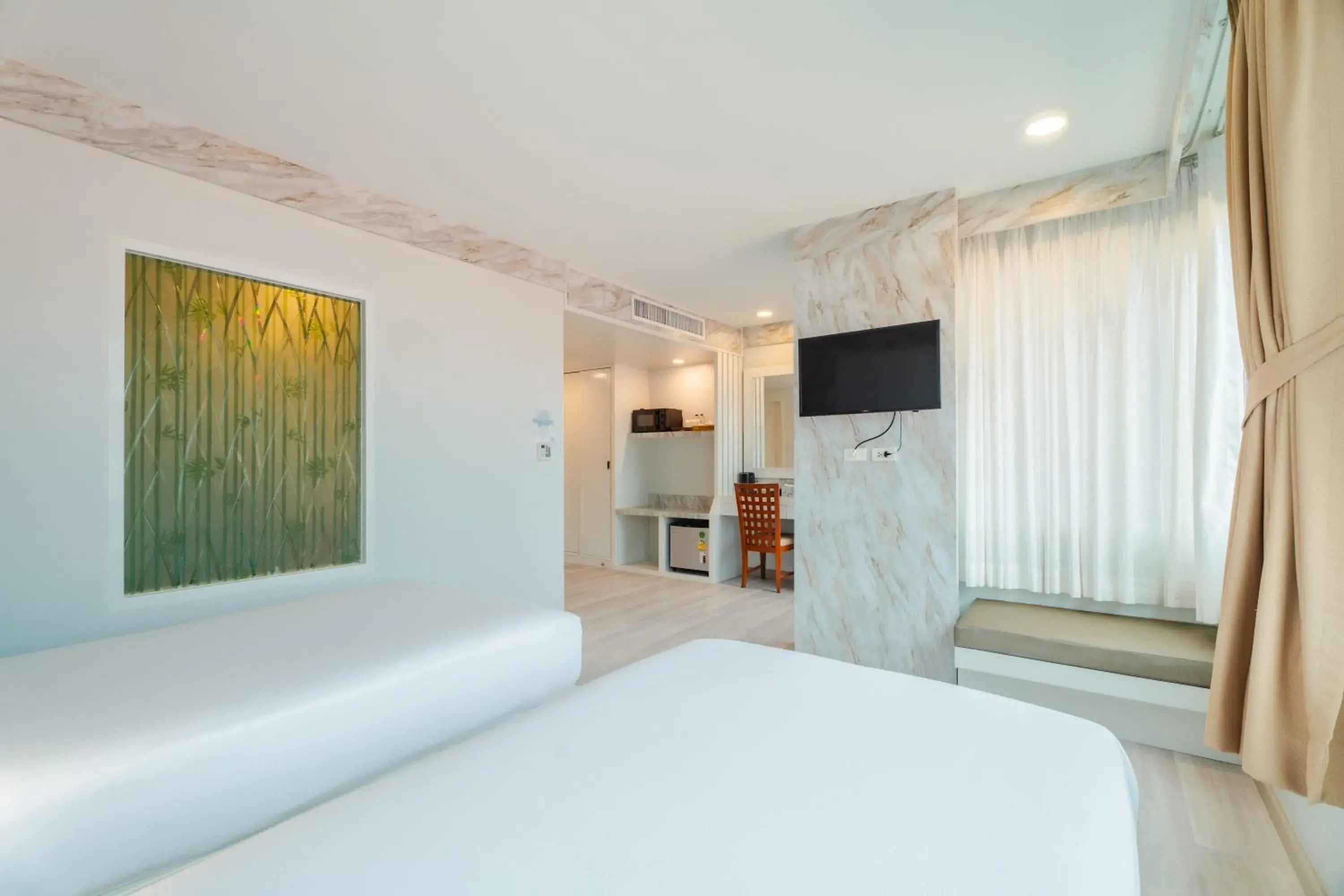 Double or Twin Room with Partial Sea View in Baumancasa Beach Resort Double or Twin Room with Partial Sea View in Baumancasa Beach Resort