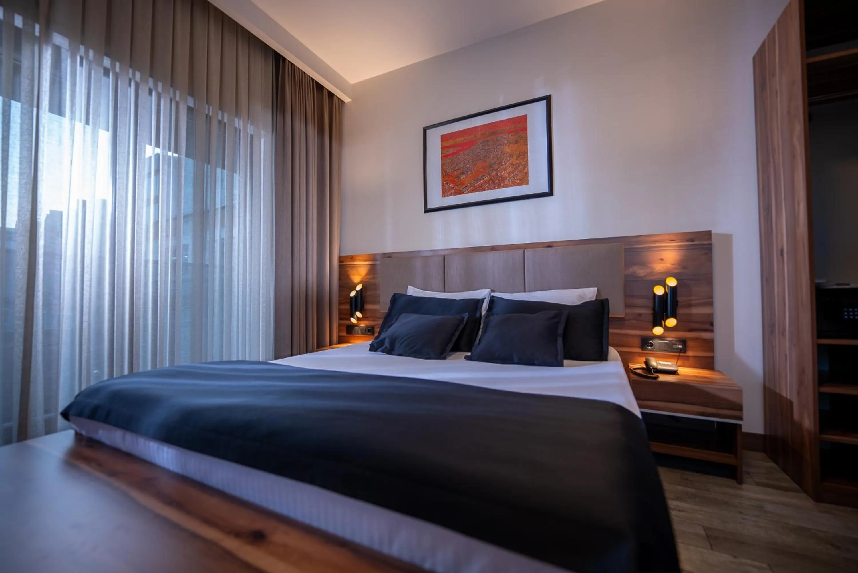 Bed in Mari Suites Hotel