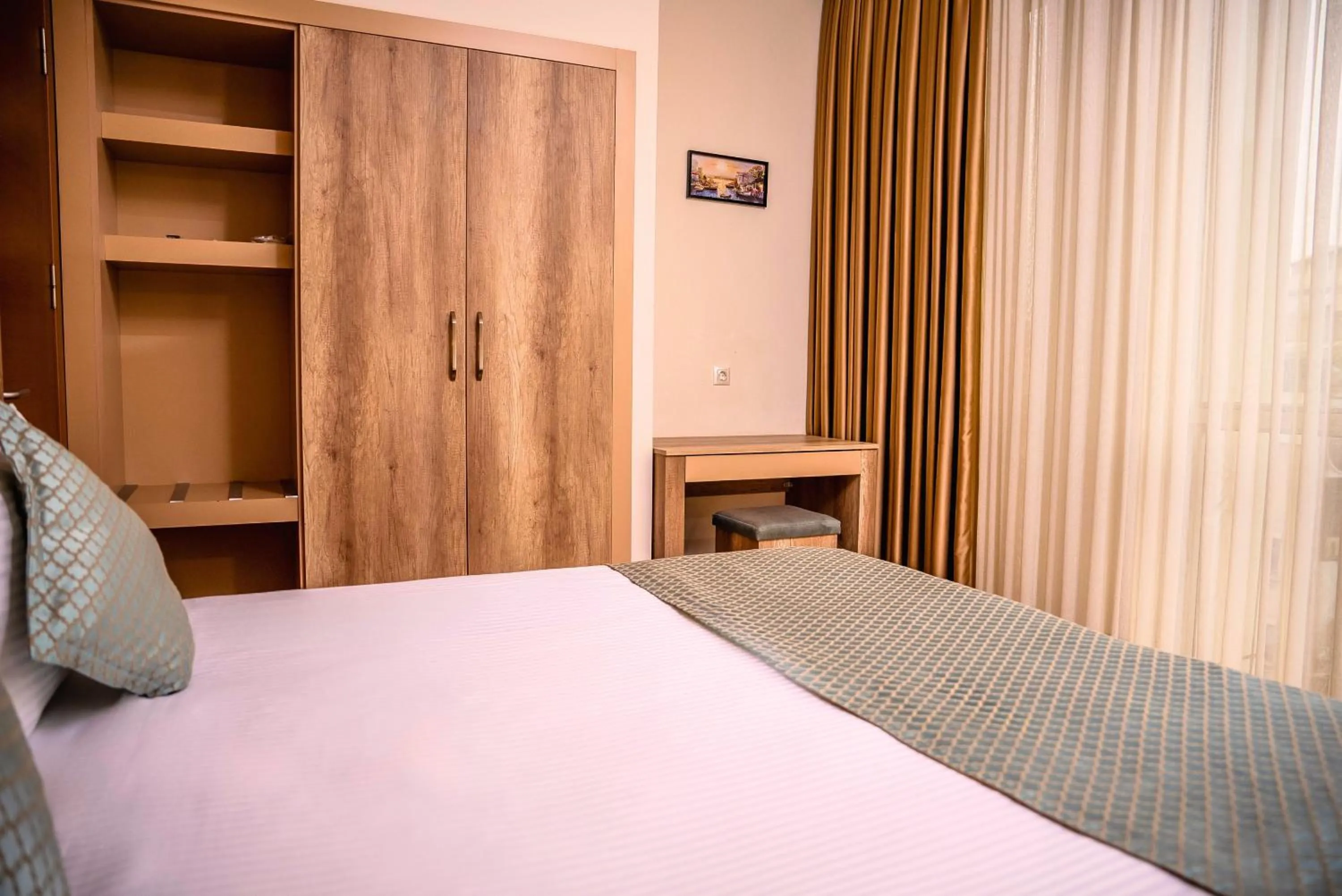 Bed in Mari Suites Hotel