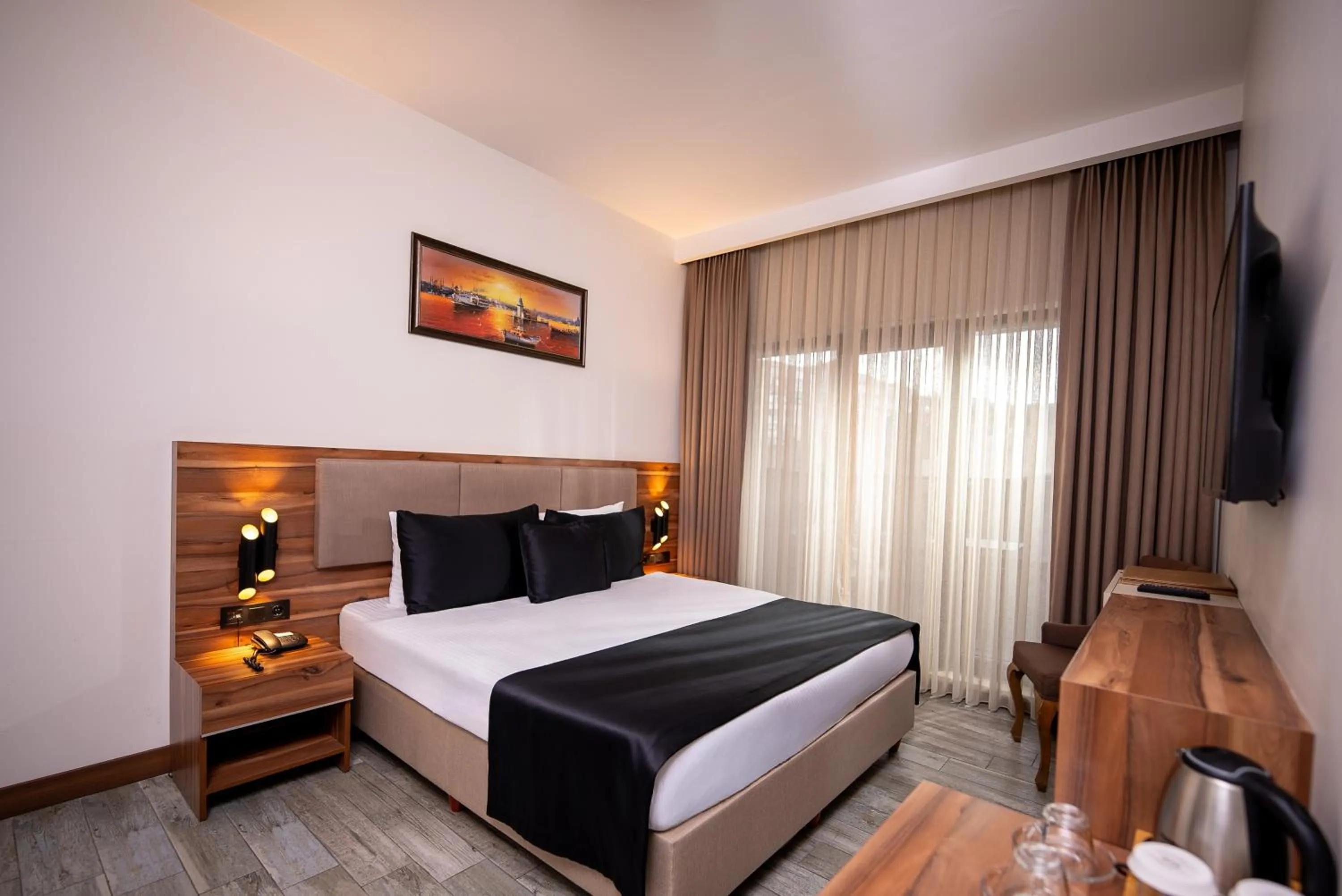 Bed in Mari Suites Hotel