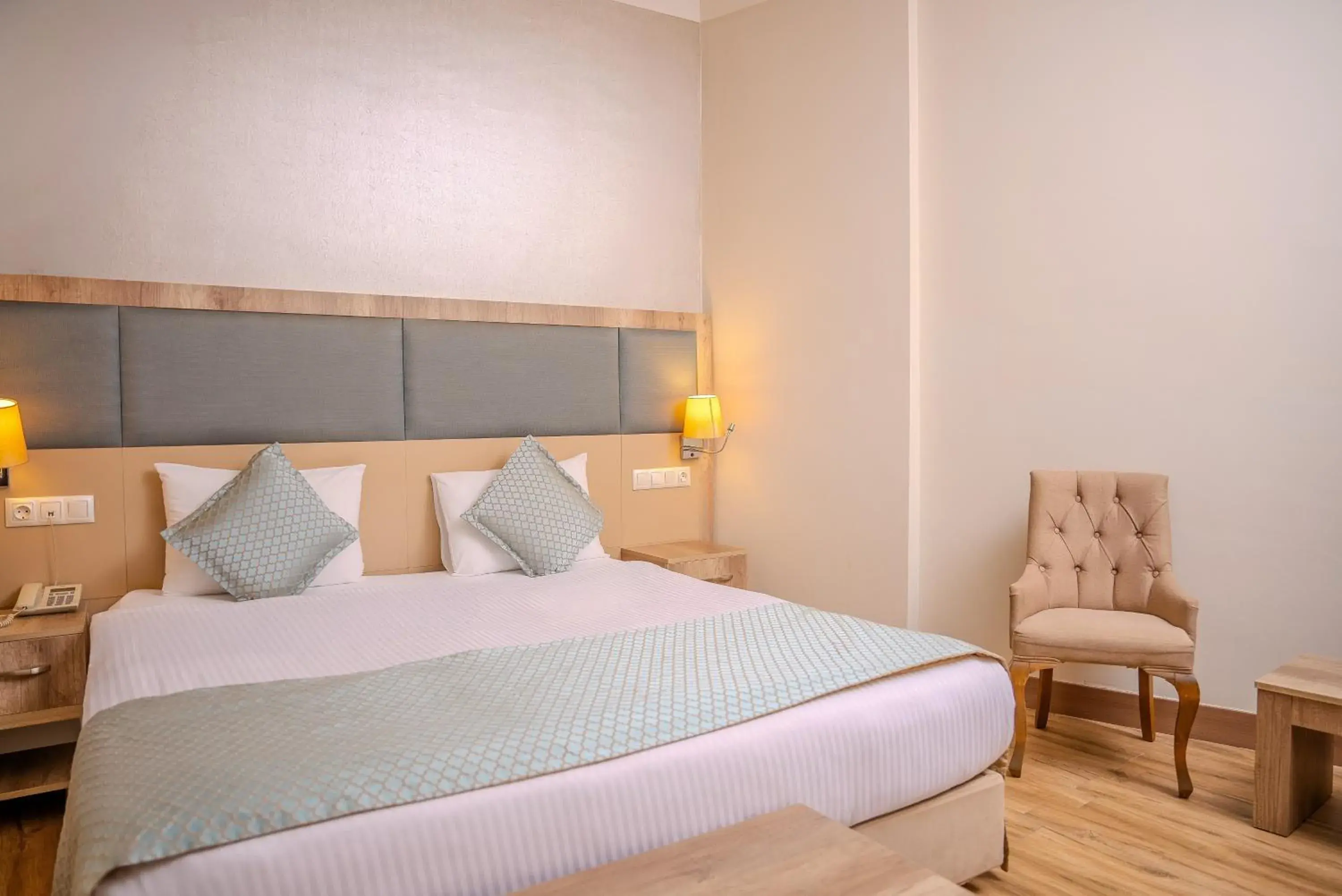 Bed in Mari Suites Hotel Bed in Mari Suites Hotel