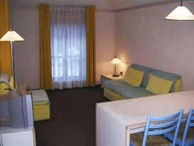 Living room, Bed in Hotel Residence Universo