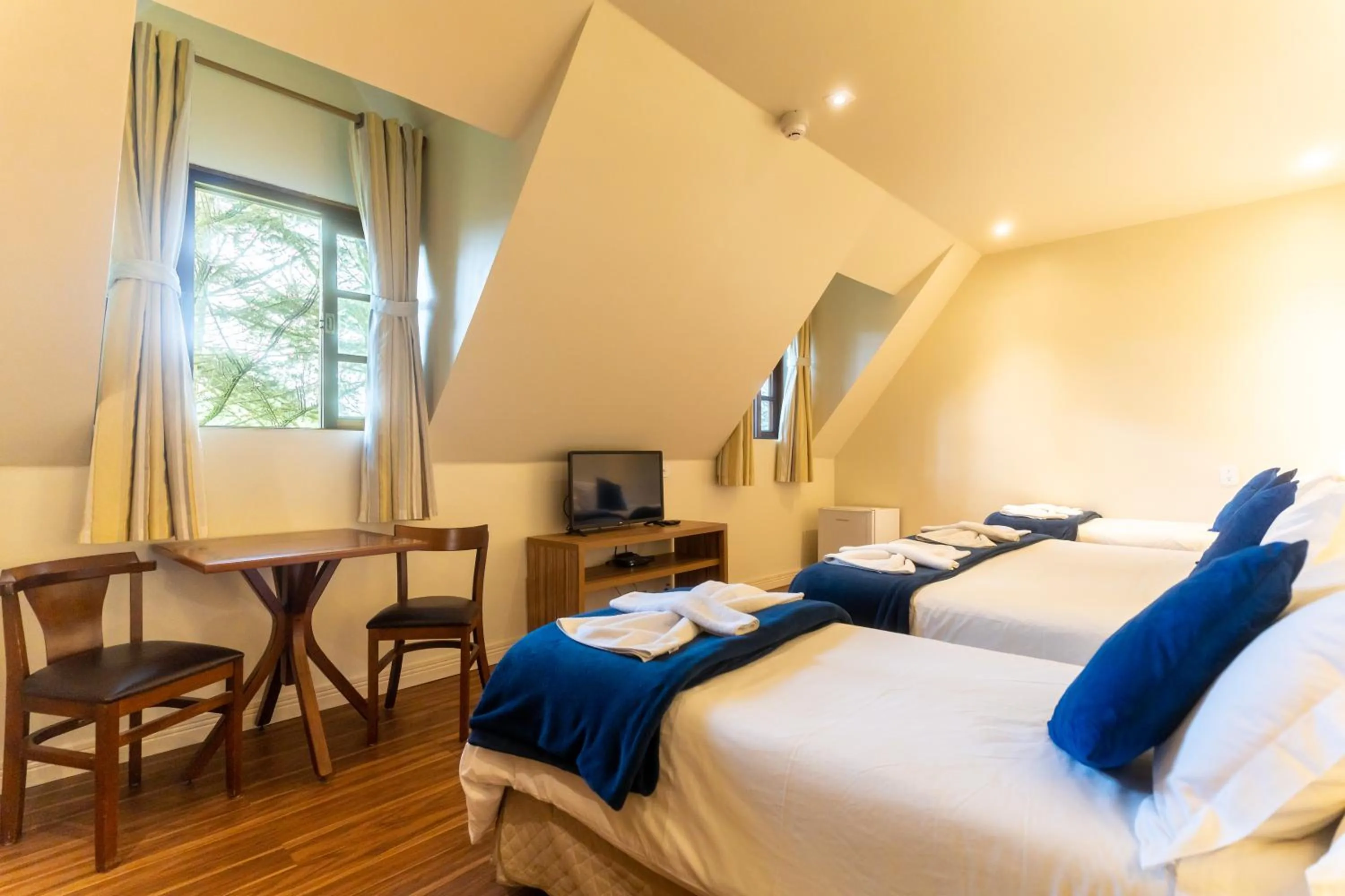 Bed in Pousada La Toscana Campos do Jordão