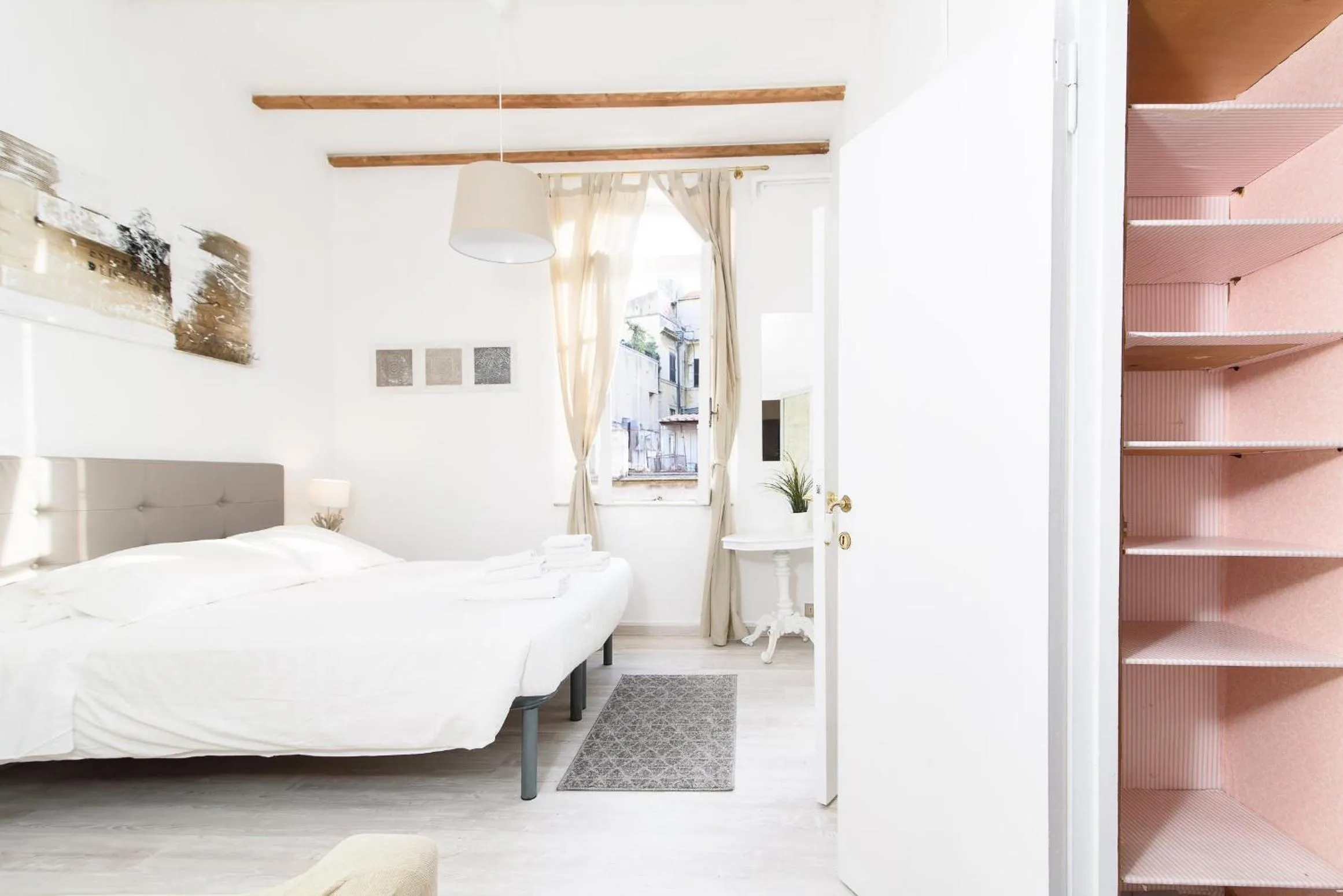 Bed in White terrace apartment navona