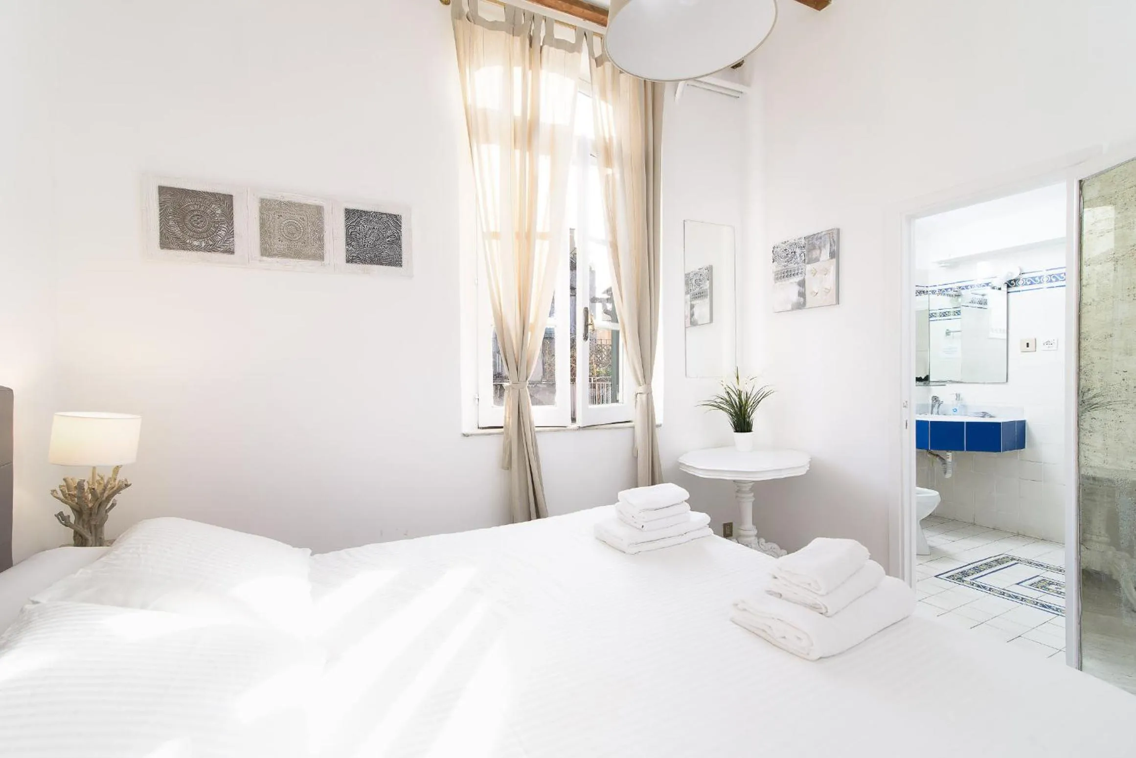 Bed in White terrace apartment navona
