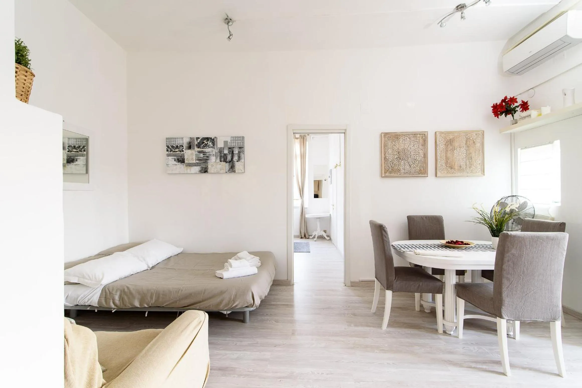 Bed in White terrace apartment navona