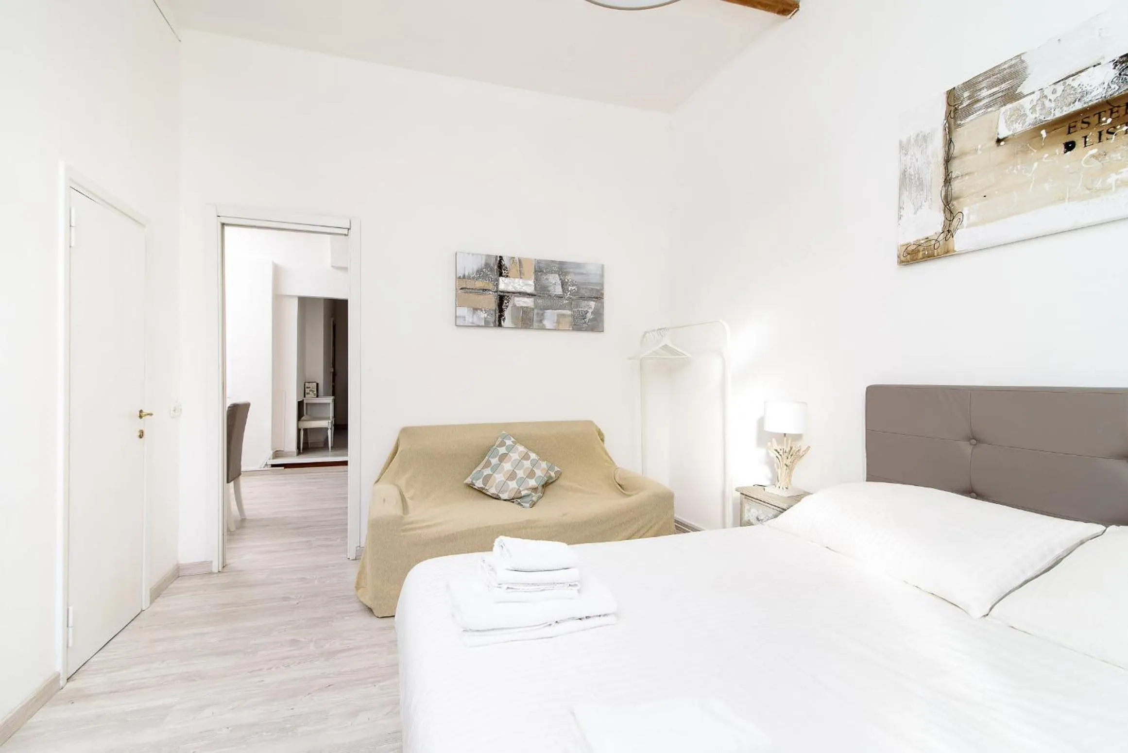 Bed in White terrace apartment navona