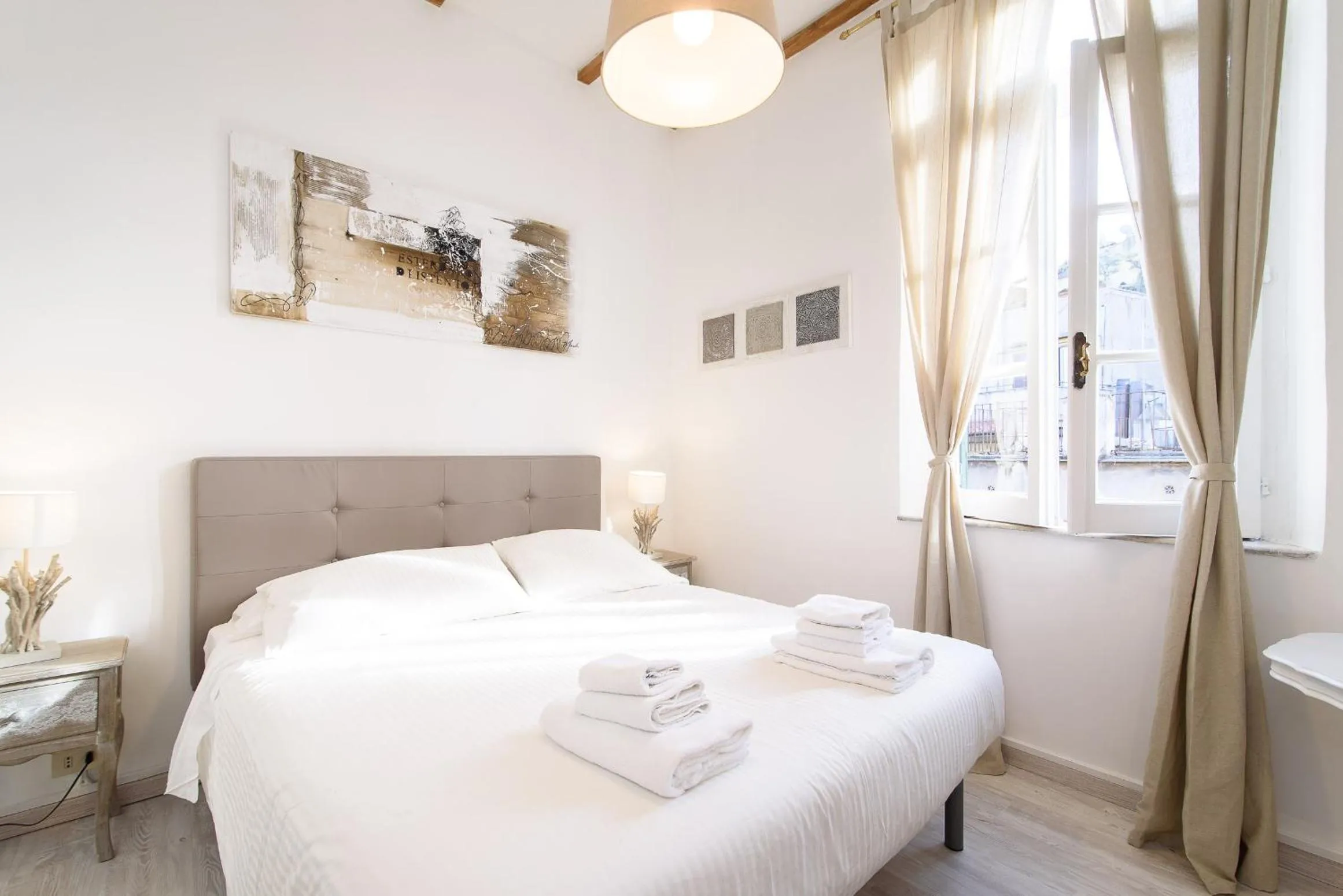 Bed in White terrace apartment navona
