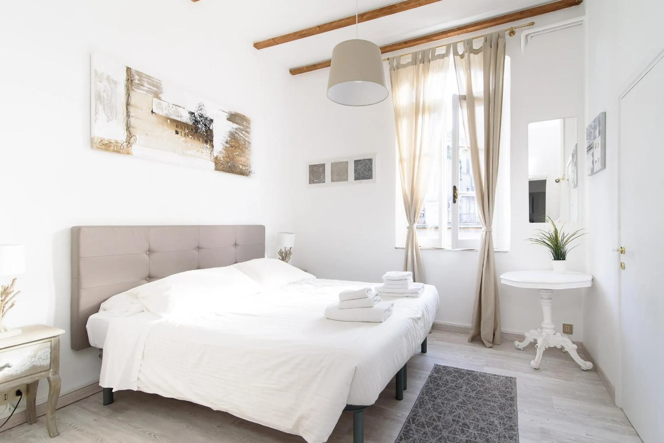 Bed in White terrace apartment navona