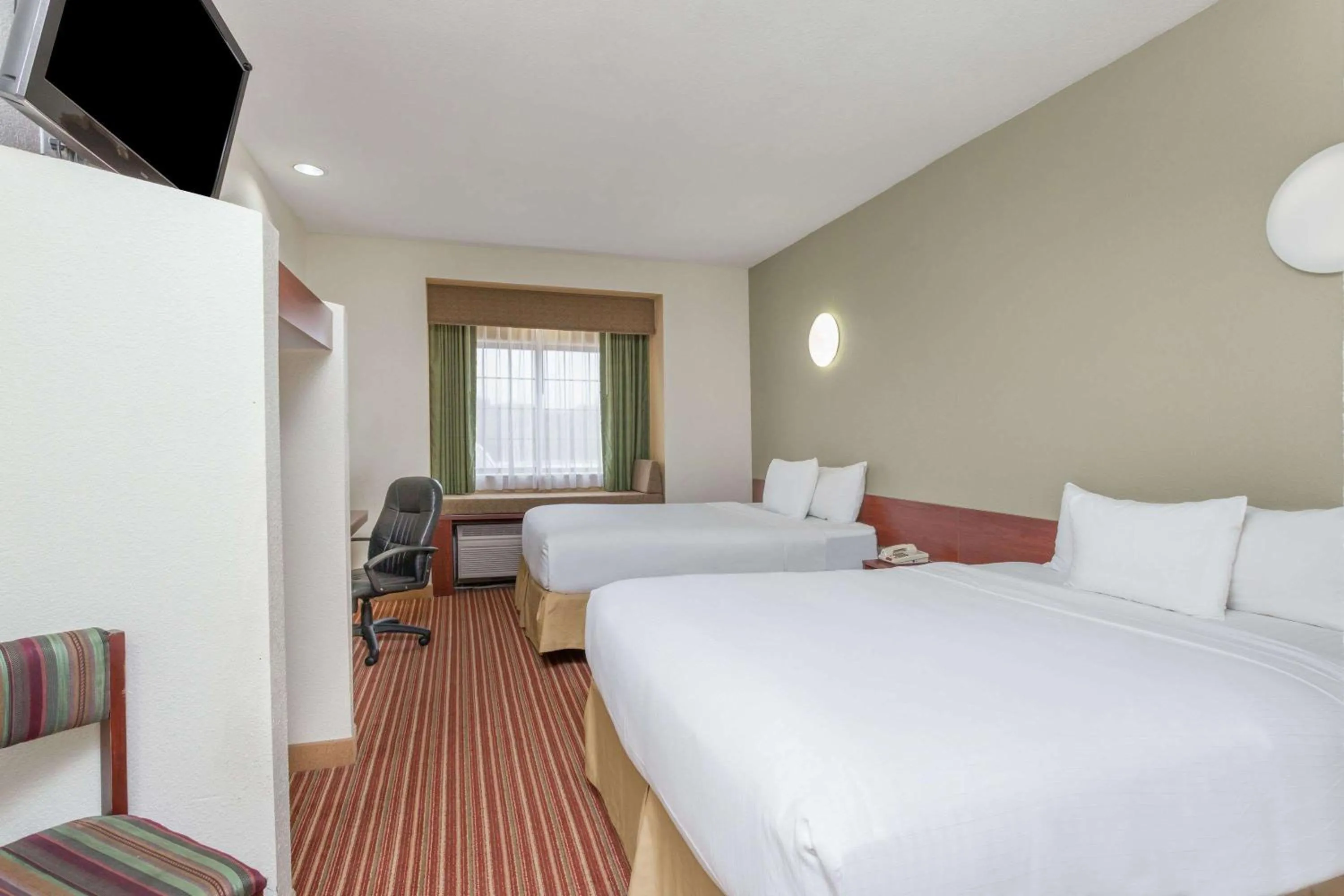 Photo of the whole room, Bed in Days Inn by Wyndham near Kansas Speedway