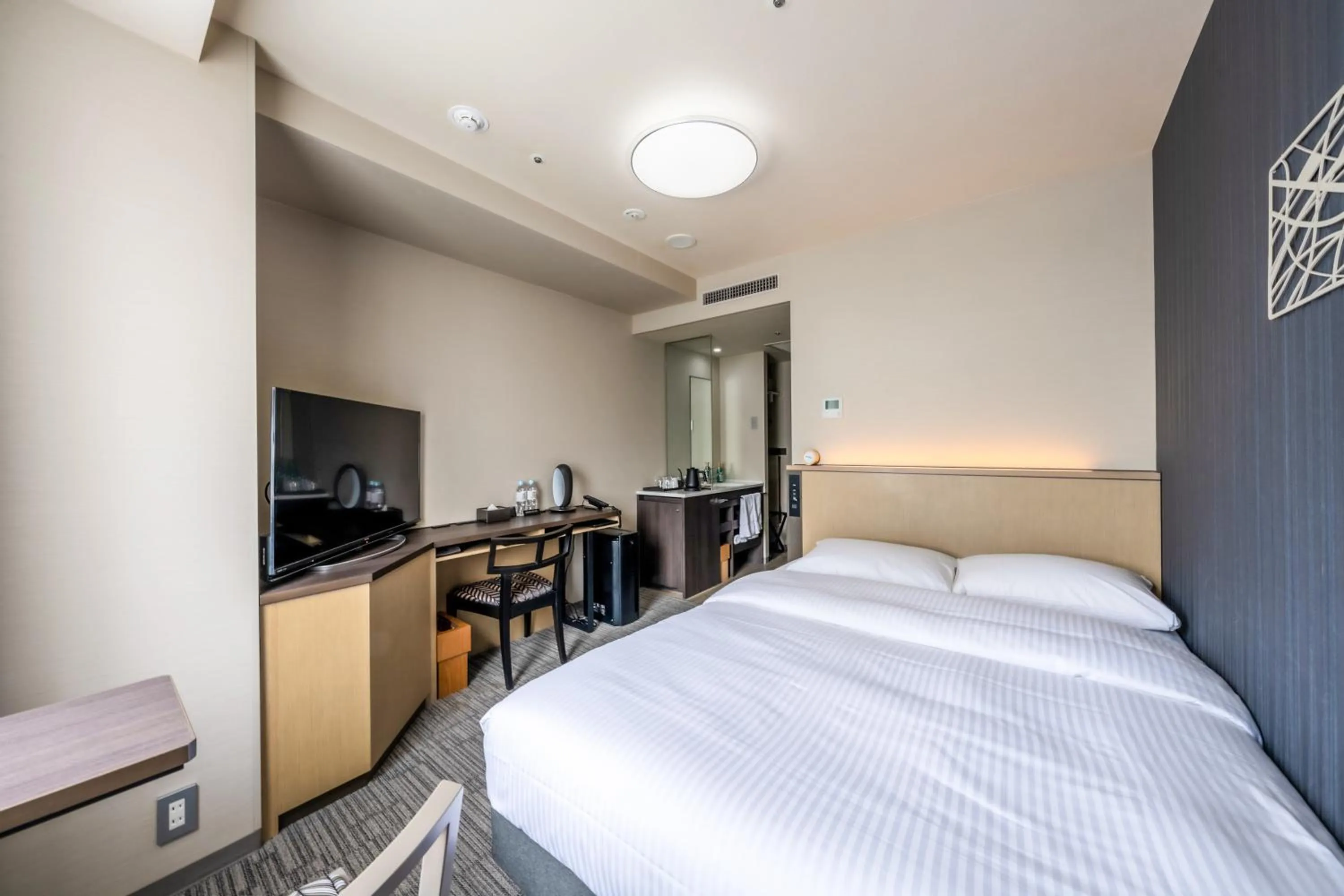 Bed in Richmond Hotel Yokohama Ekimae