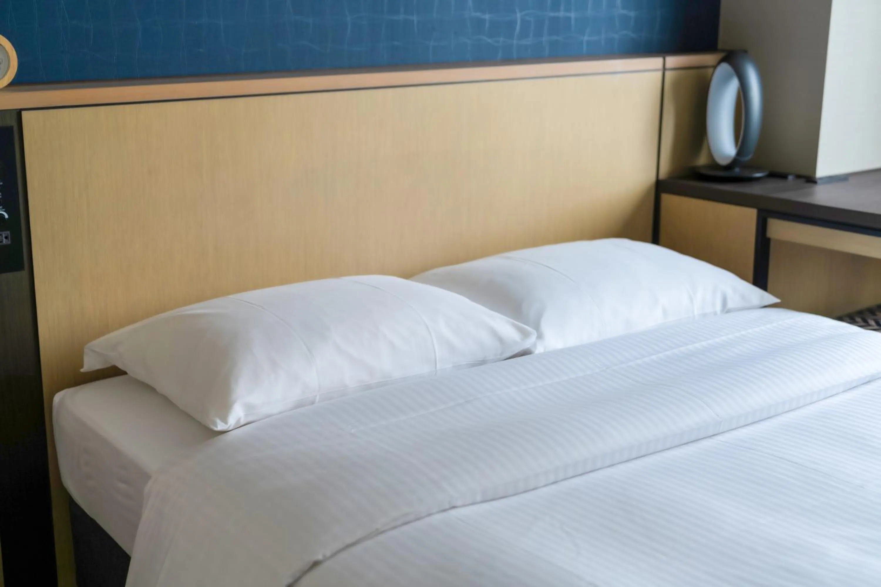 Bed in Richmond Hotel Yokohama Ekimae