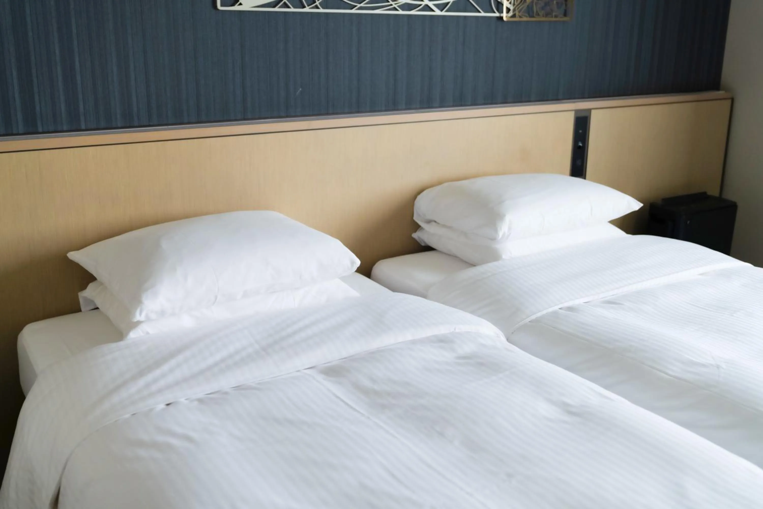 Bed in Richmond Hotel Yokohama Ekimae