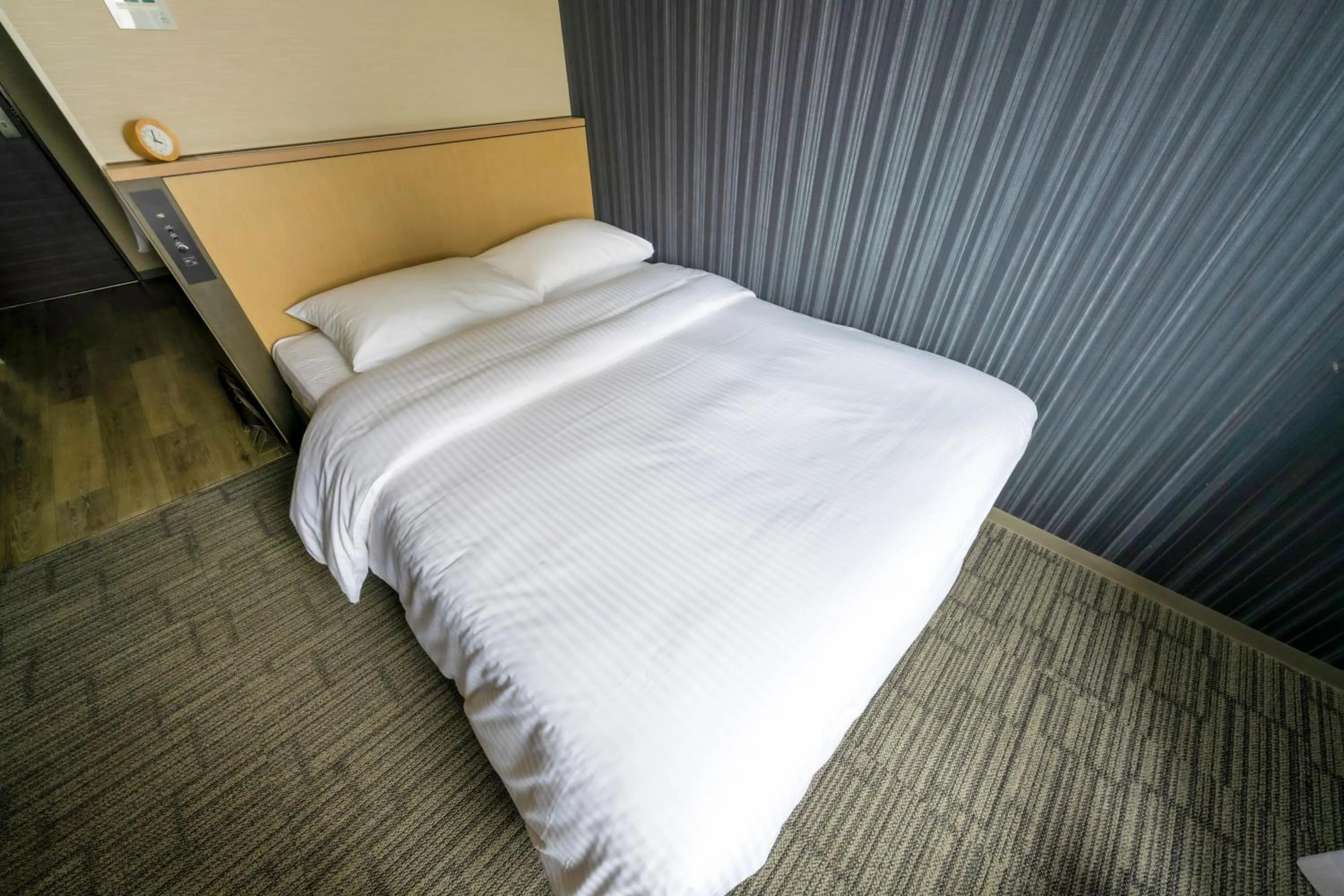 Bed in Richmond Hotel Yokohama Ekimae