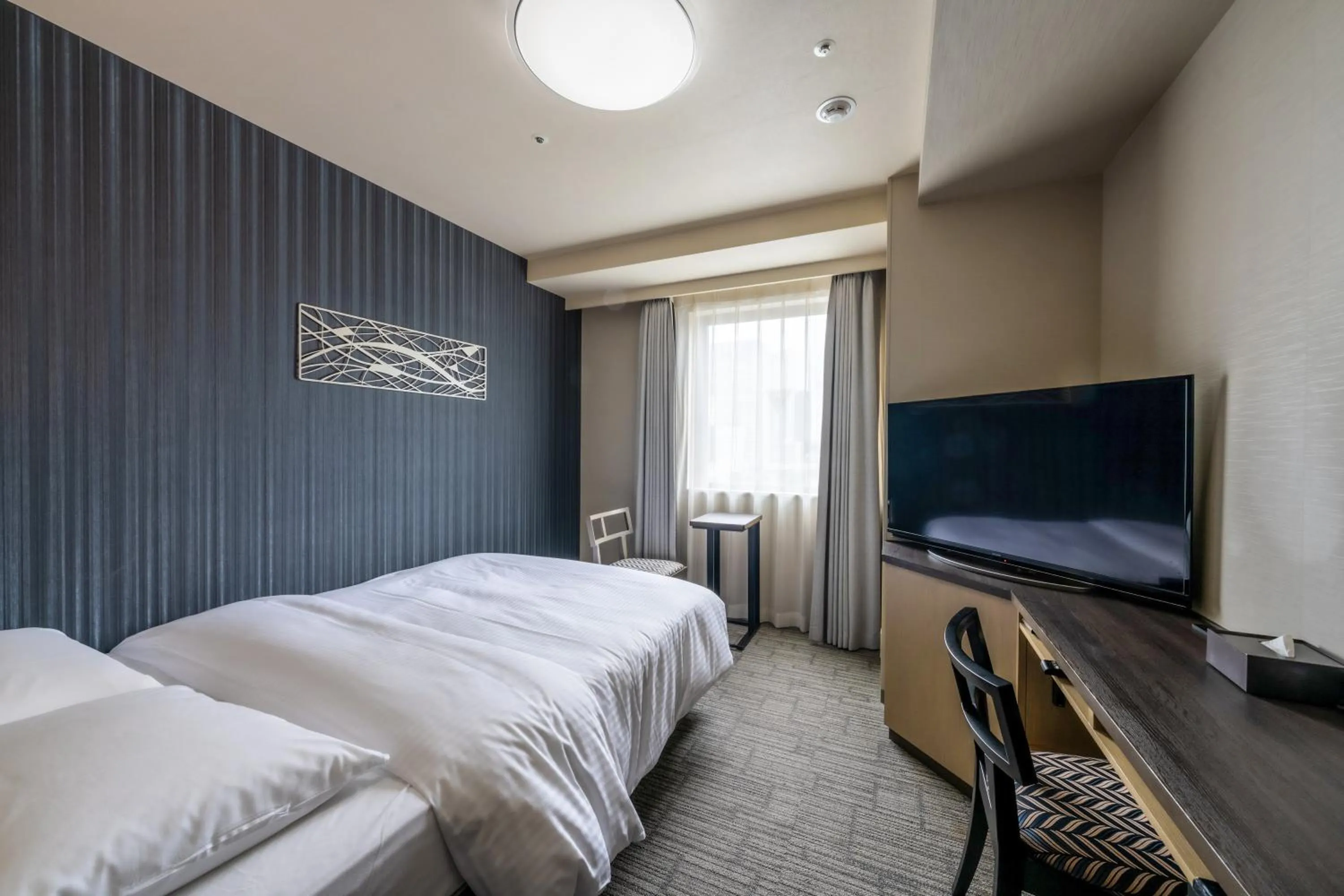 Bed in Richmond Hotel Yokohama Ekimae