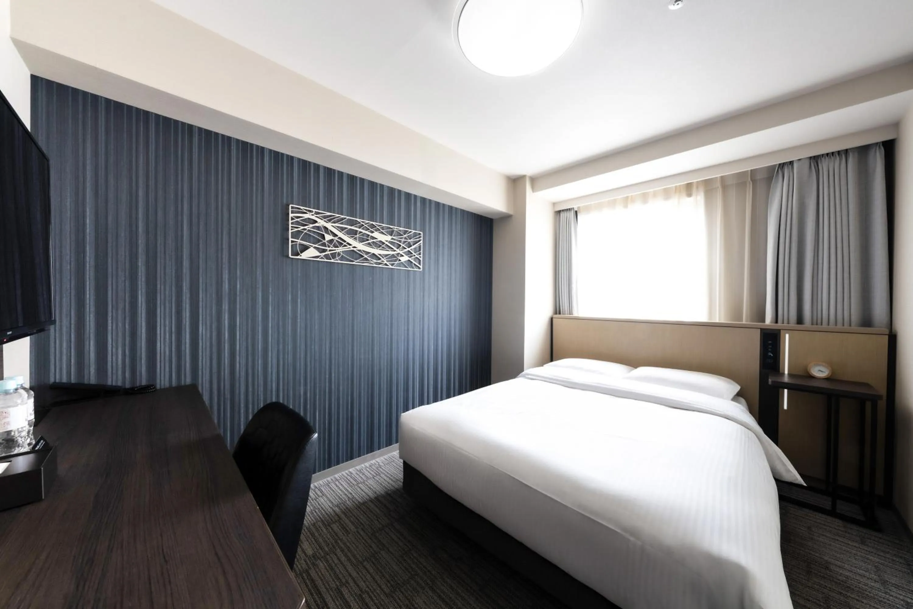 Bed in Richmond Hotel Yokohama Ekimae