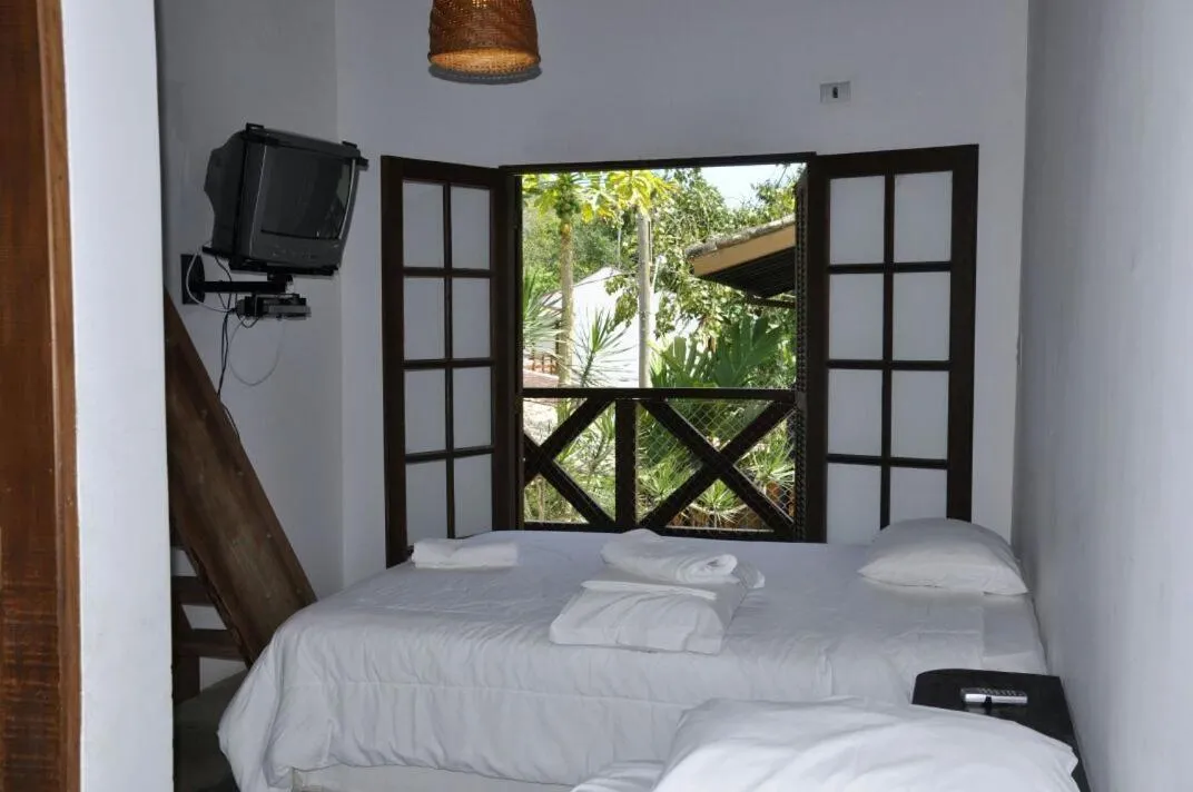 Bed in Pousada Pedra Porosa
