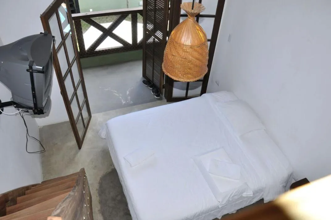 Bed in Pousada Pedra Porosa
