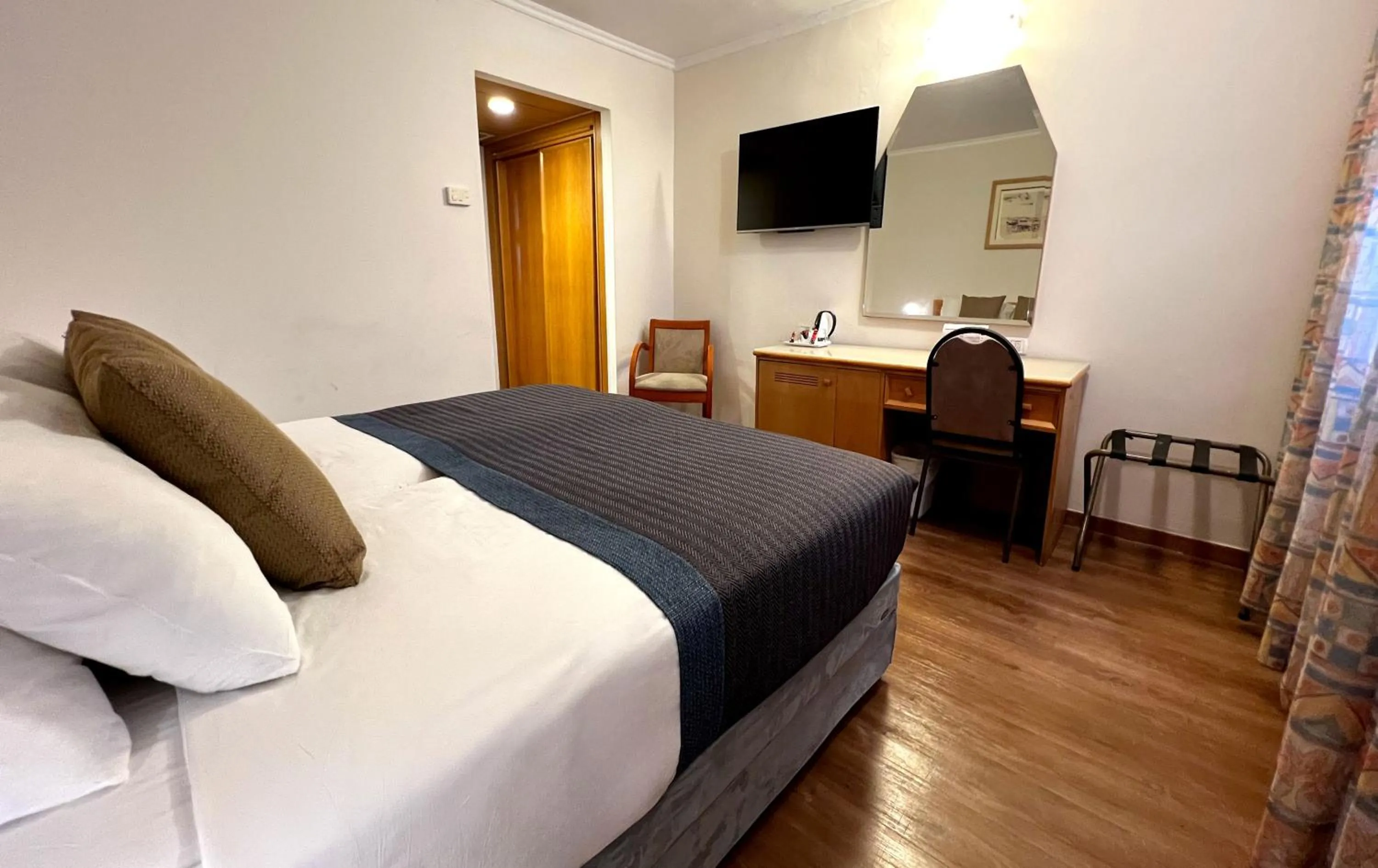 Bed in Caesar Premier Jerusalem Hotel