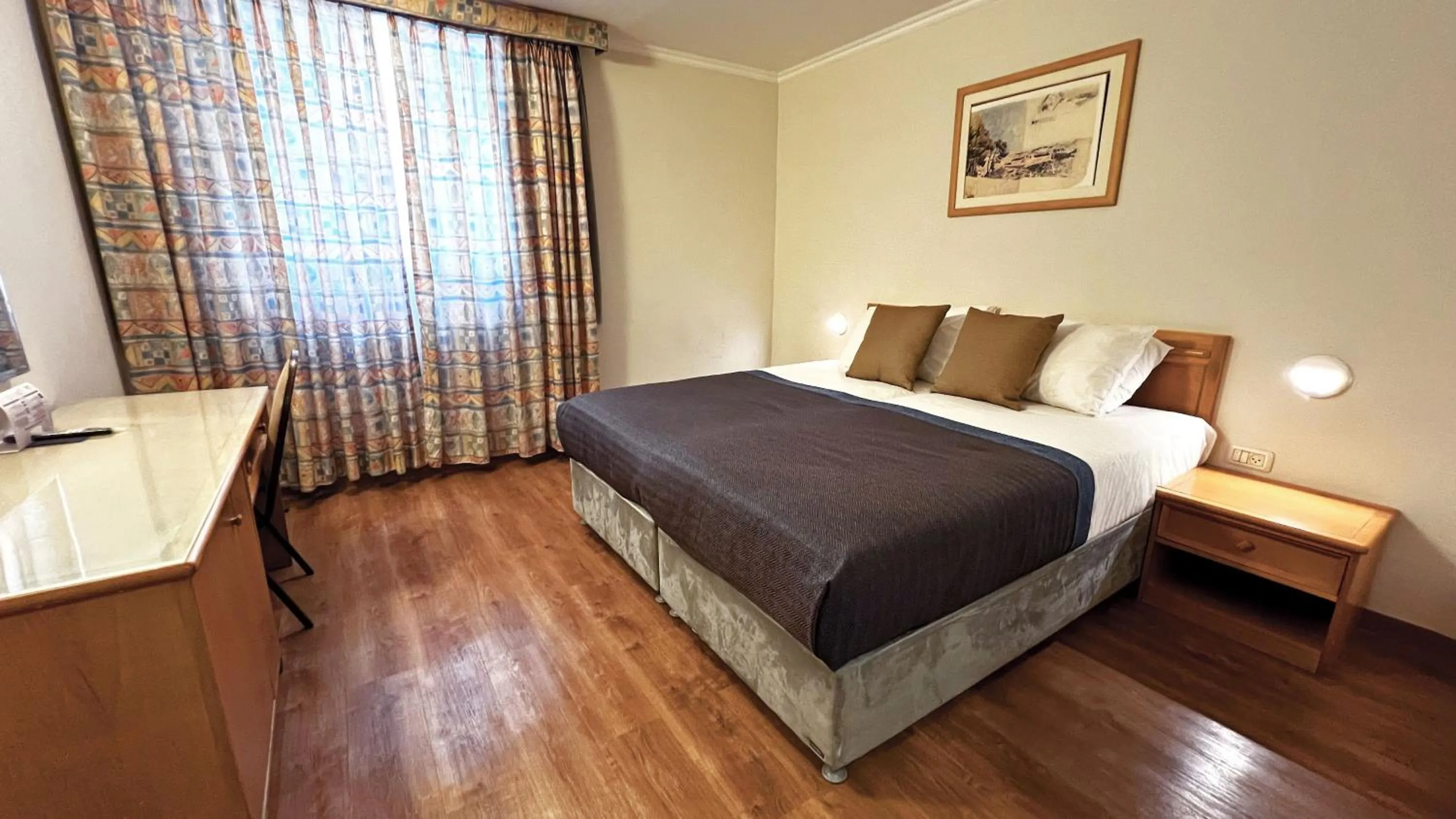 Bed in Caesar Premier Jerusalem Hotel