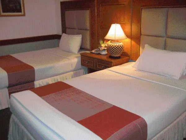 Bed in Raya Grand Hotel