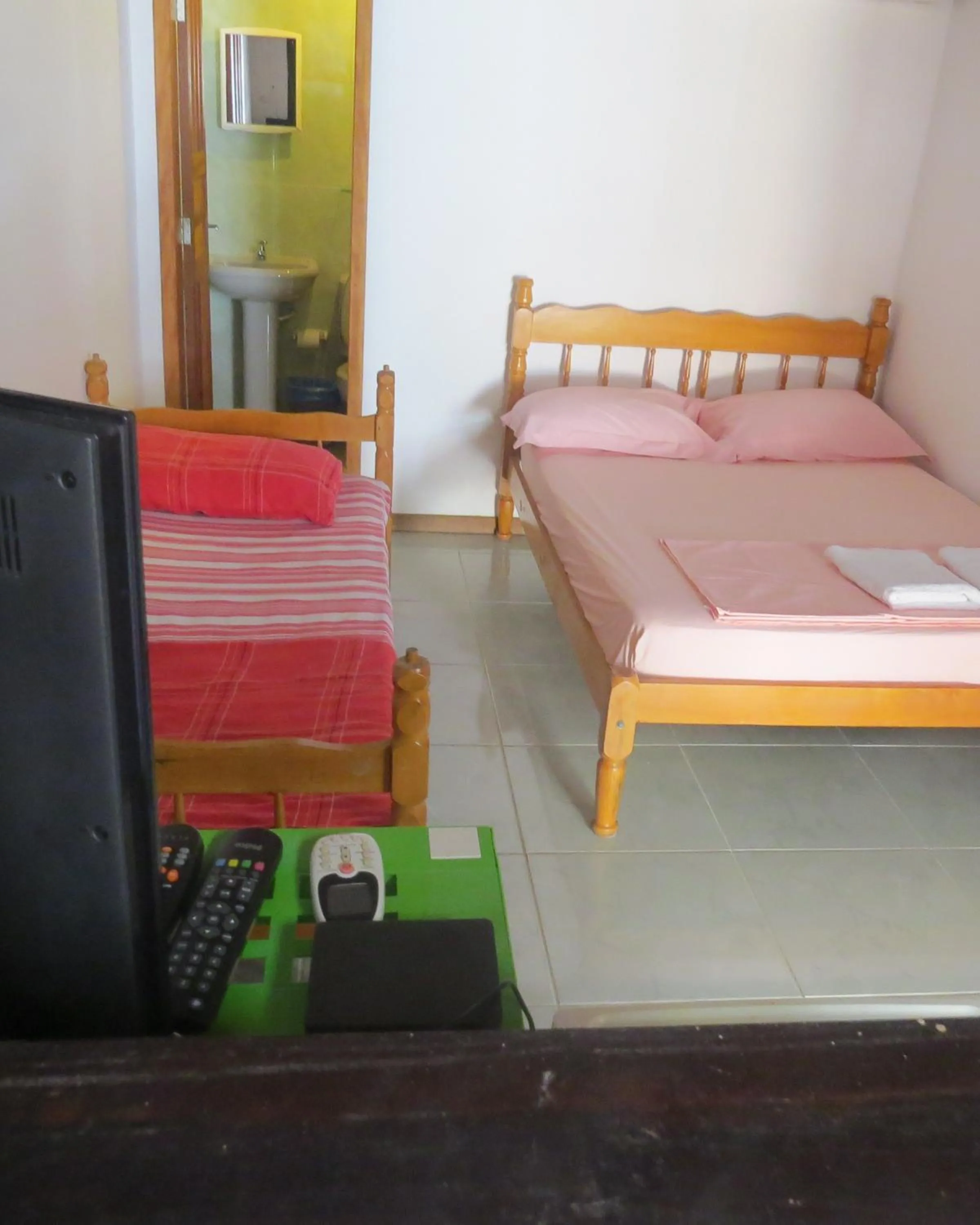 Bed in Pousada Brasil Tropical