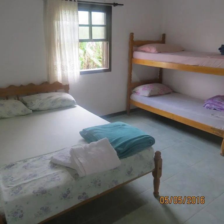 Bed in Pousada Brasil Tropical