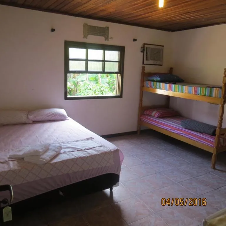 Bed in Pousada Brasil Tropical