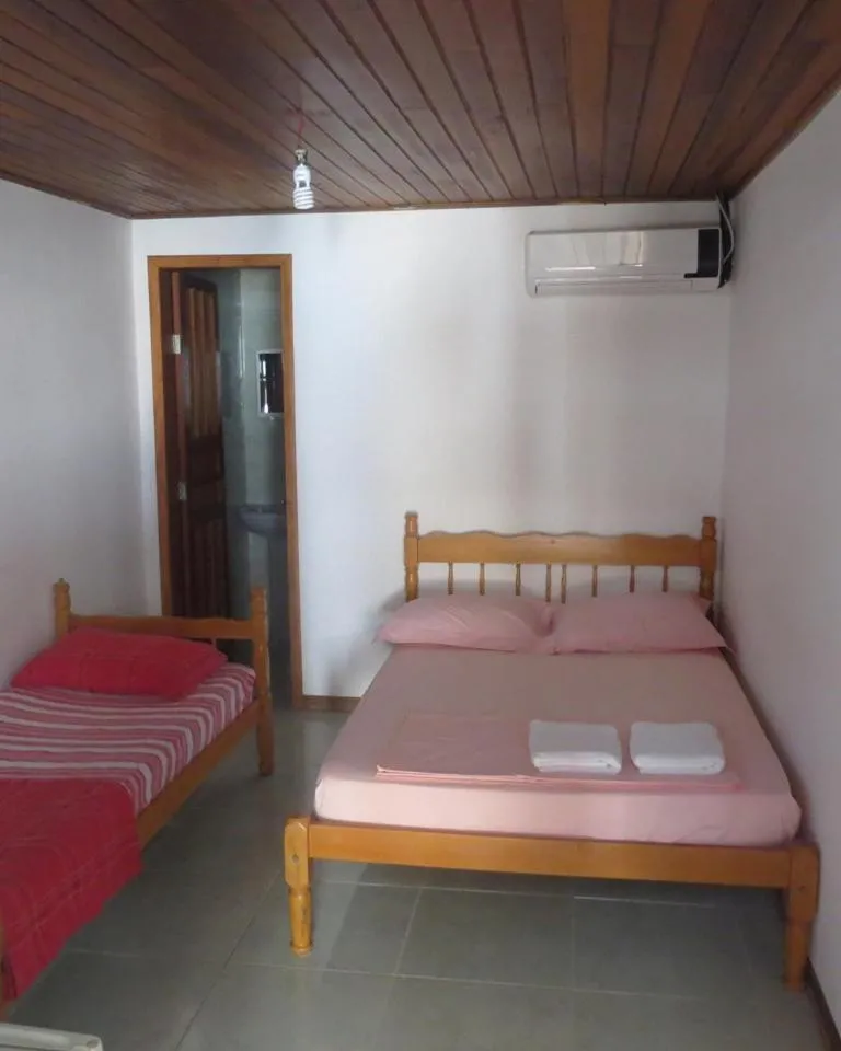 Bed in Pousada Brasil Tropical