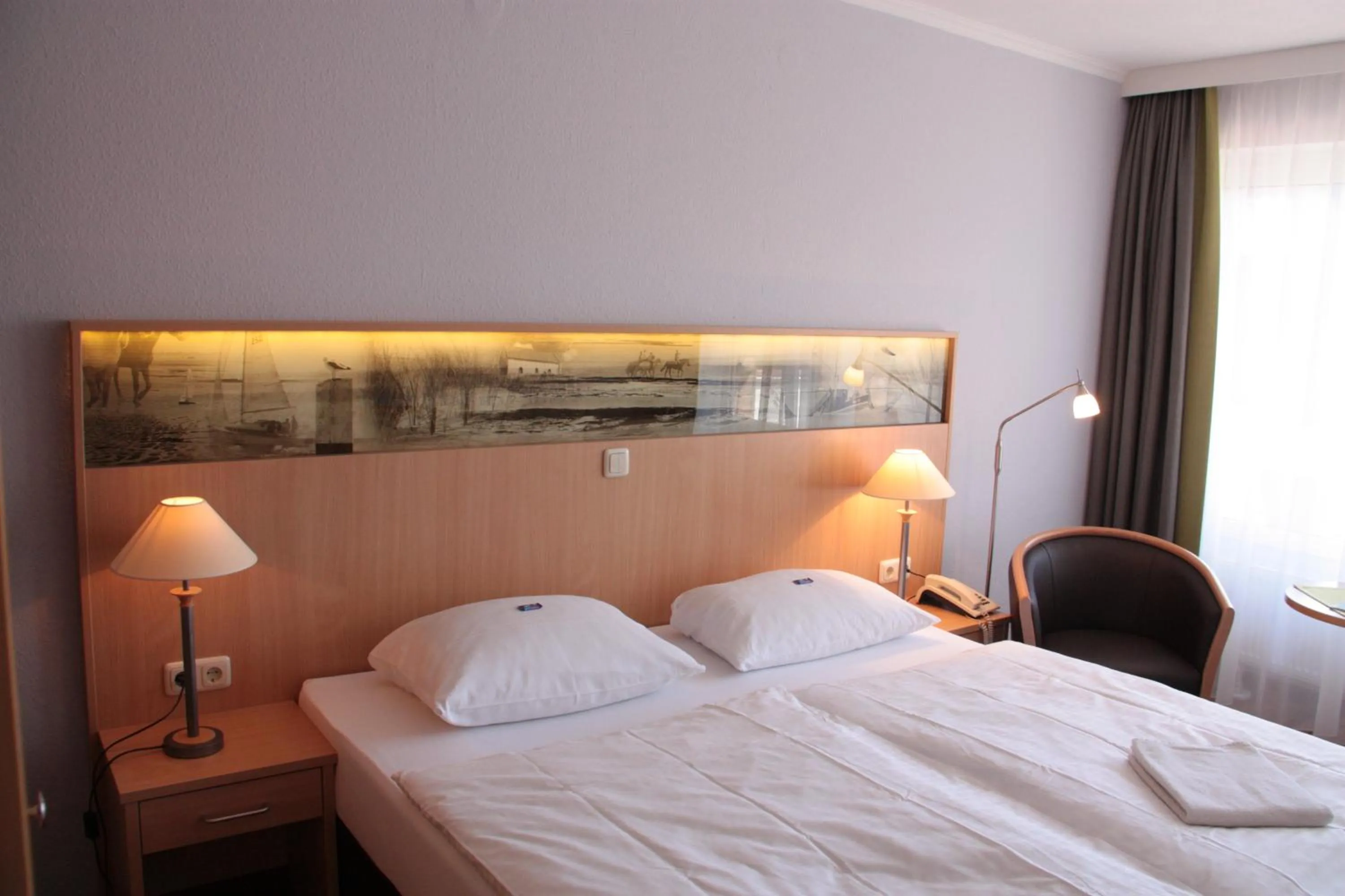 Photo of the whole room, Bed in Hotel Spiekeroog