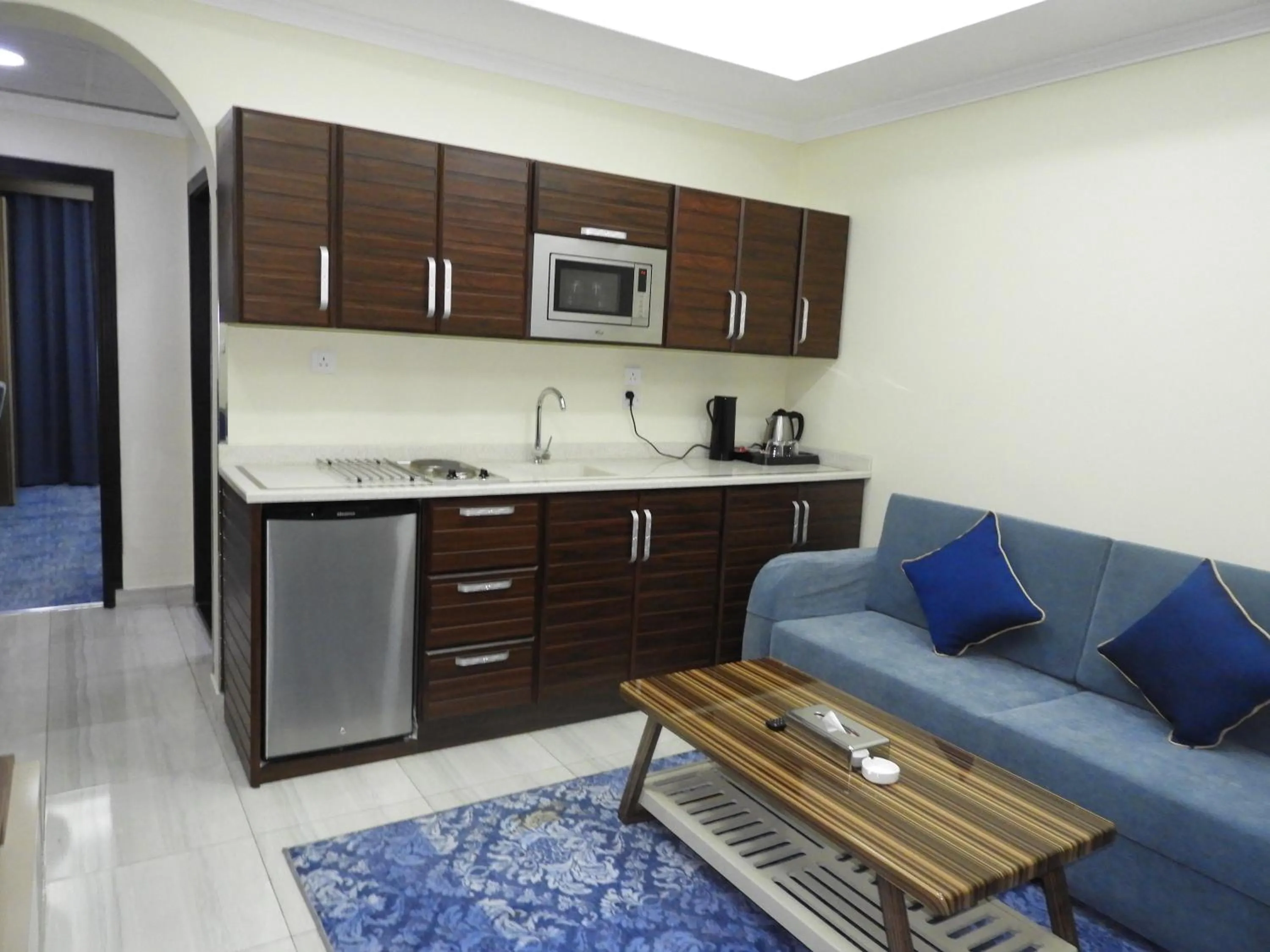 Kitchen or kitchenette in Swiss Blue serviced Apartments- Al Zahra