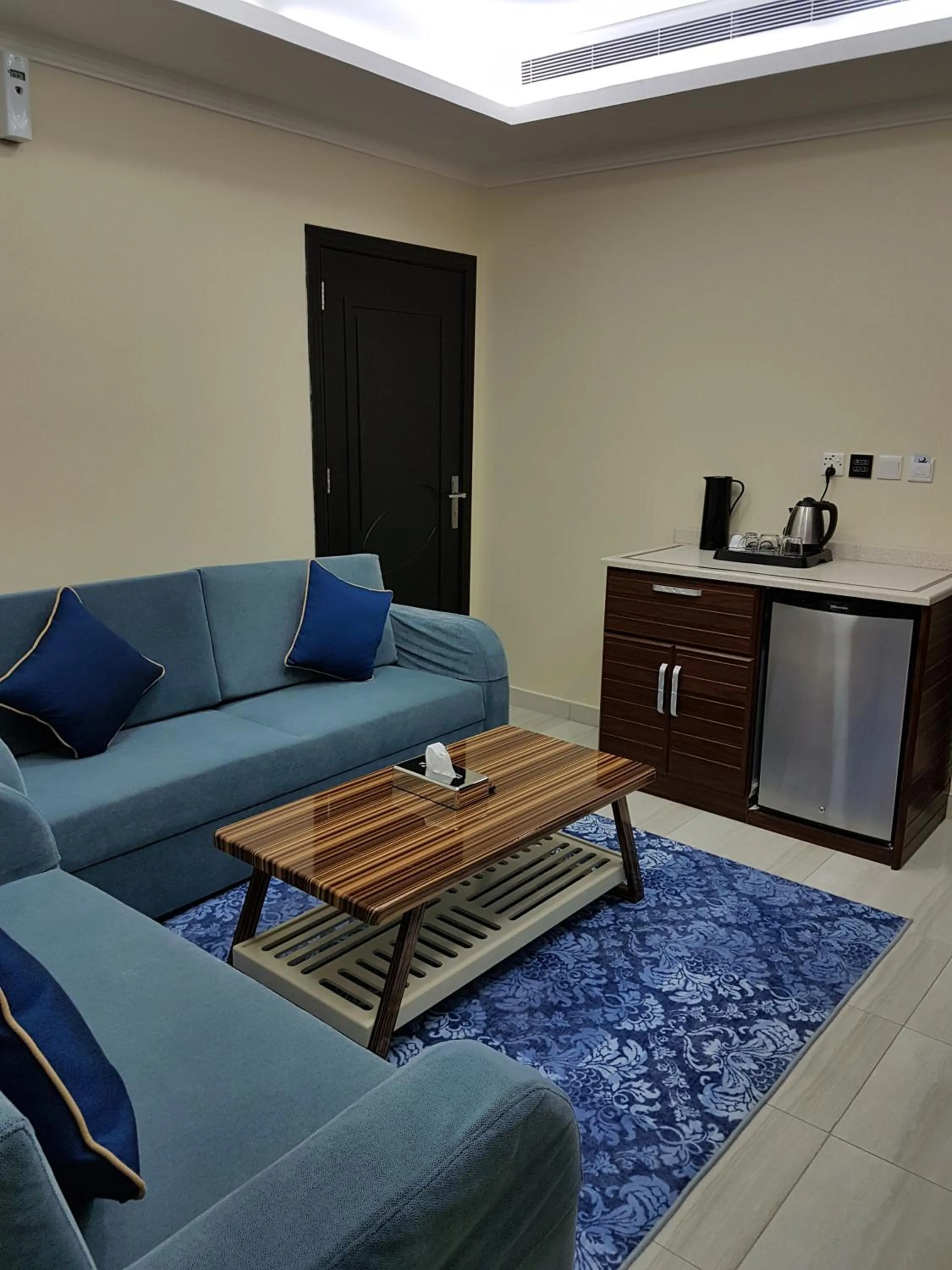 Living room in Swiss Blue serviced Apartments- Al Zahra