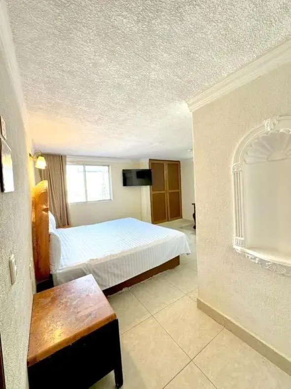 Photo of the whole room, Bed in Suites Cancun Center Photo of the whole room, Bed in Suites Cancun Center