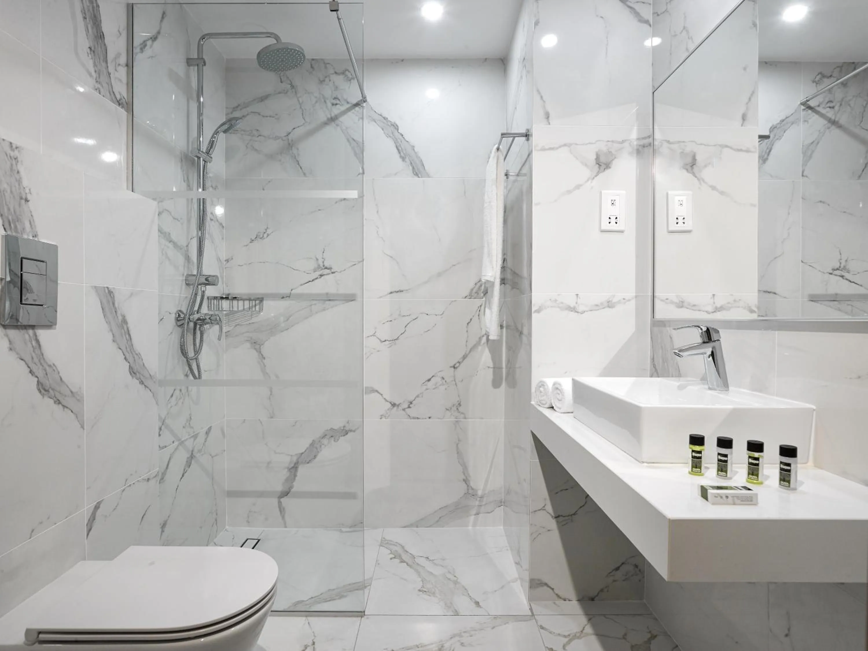 Toilet in The Blue Ivy Hotel & Suites