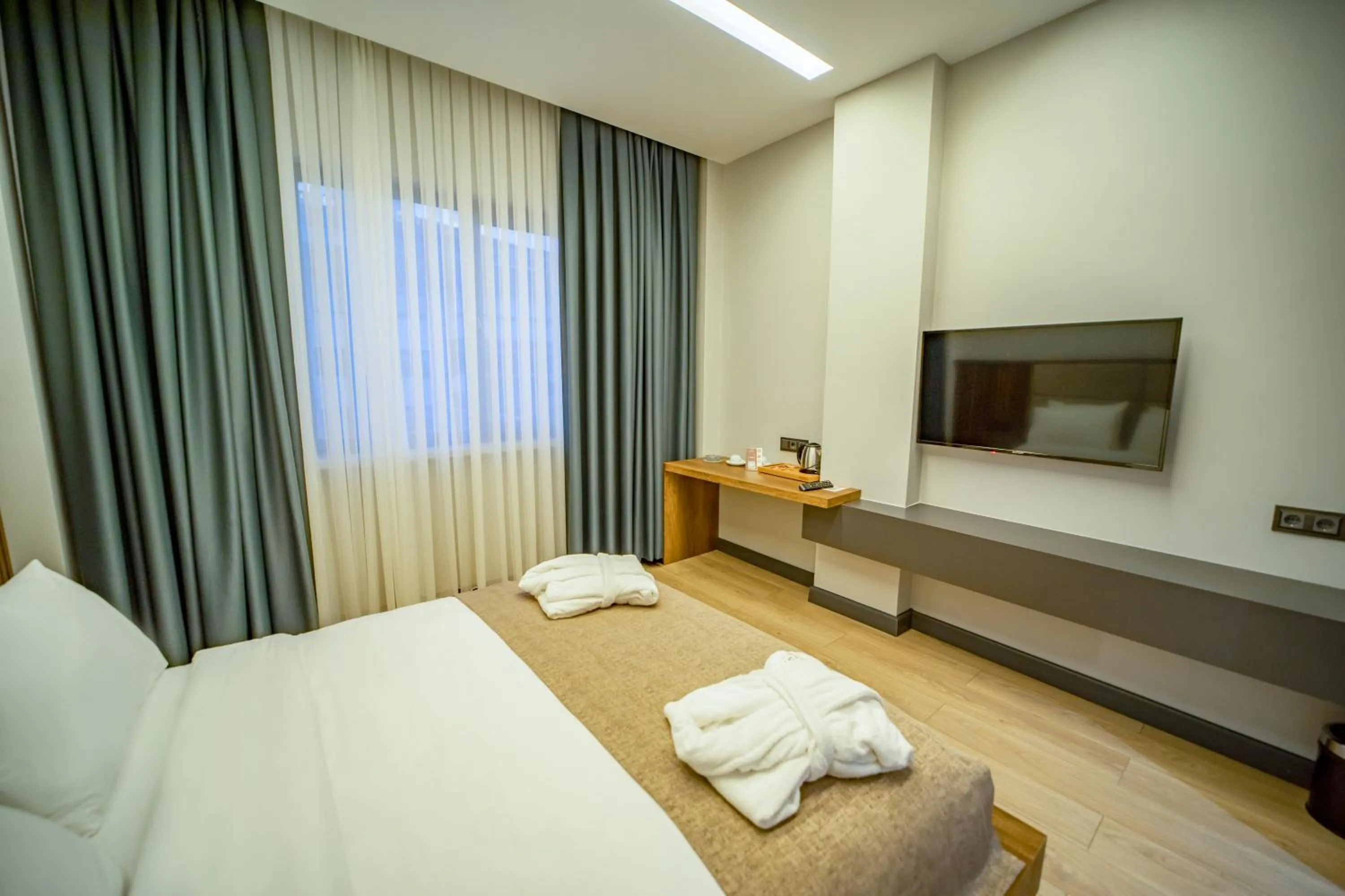 TV and multimedia, Bed in Aksular Hotel