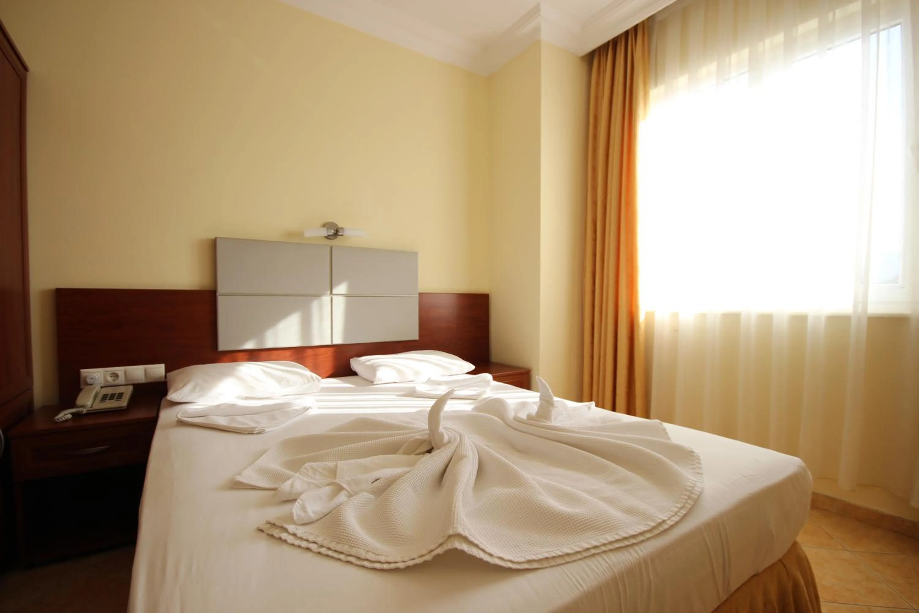 Bed in Minta Apart Hotel