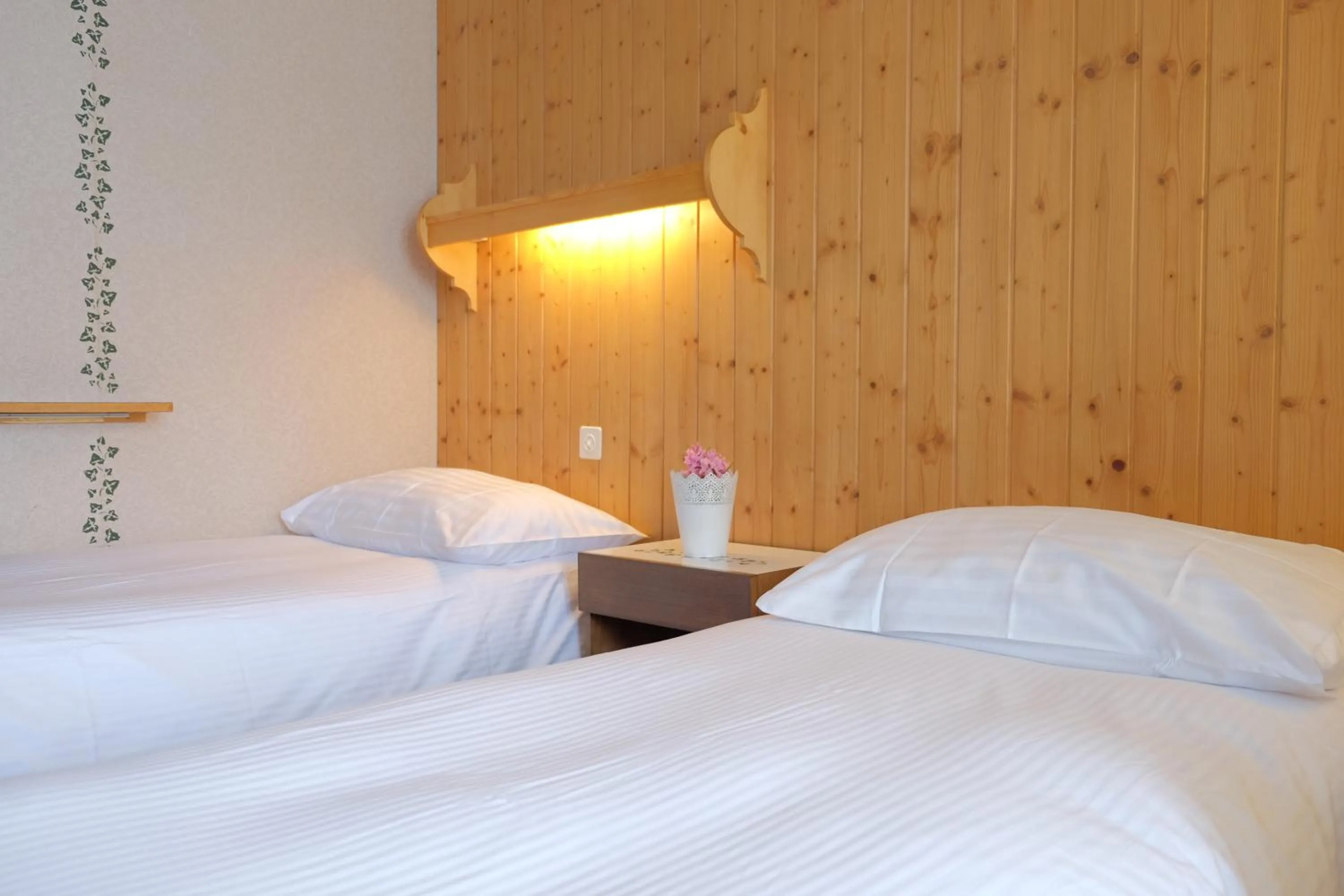 Bed in Guest Rooms with a great view at Residence Brunner