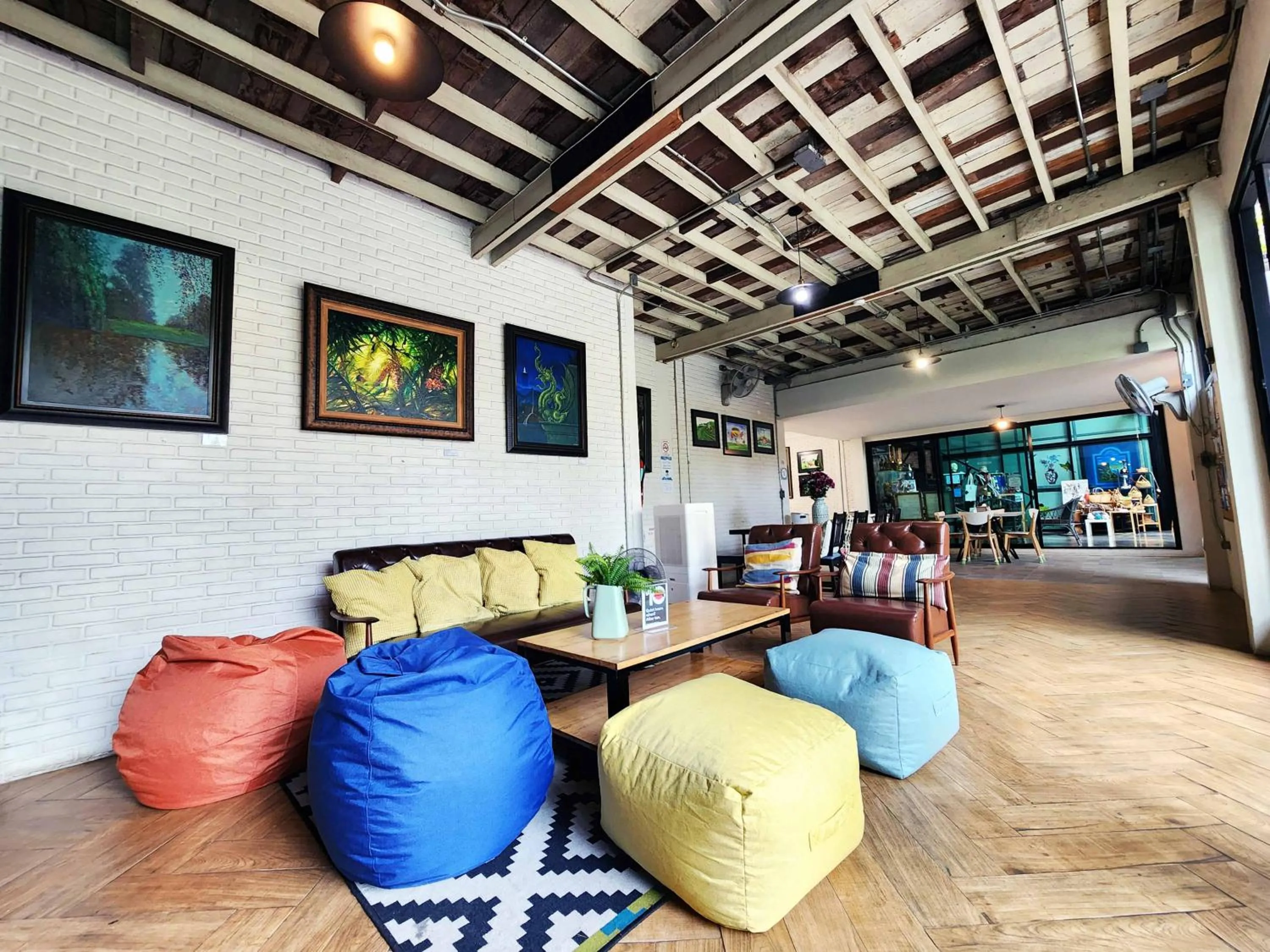 Seating area in Baan Mai Kradan Hostel Chiang Rai