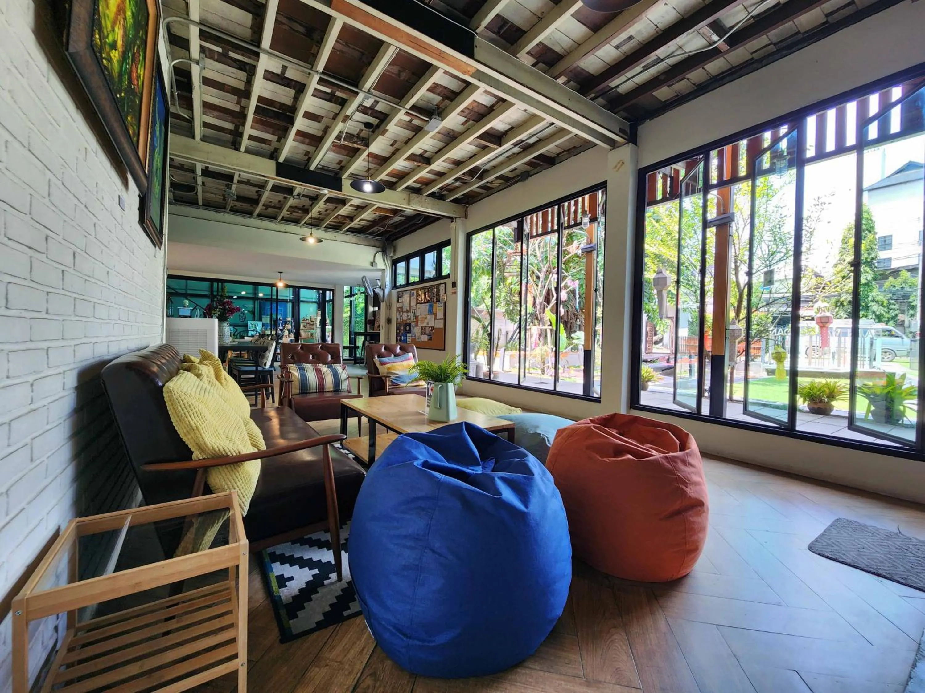 Seating area in Baan Mai Kradan Hostel Chiang Rai
