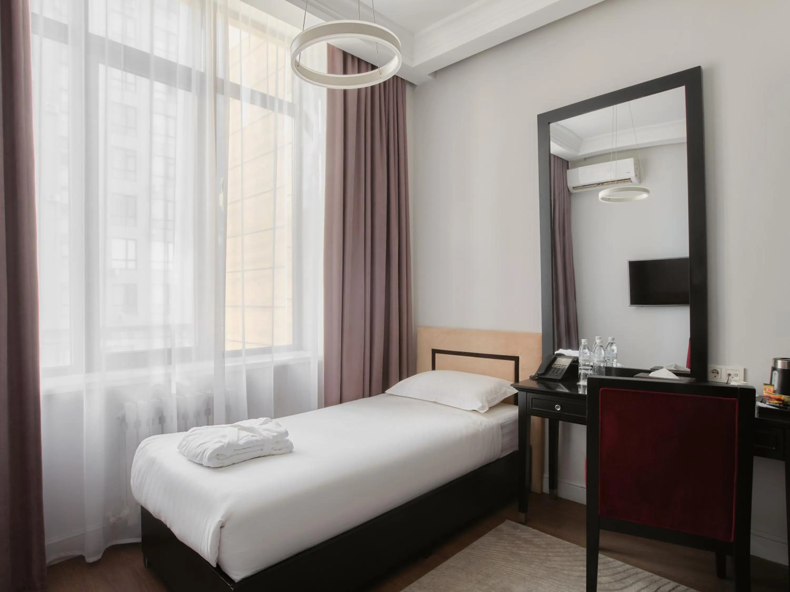 Photo of the whole room, Bed in Madison Ave Hotel Bishkek