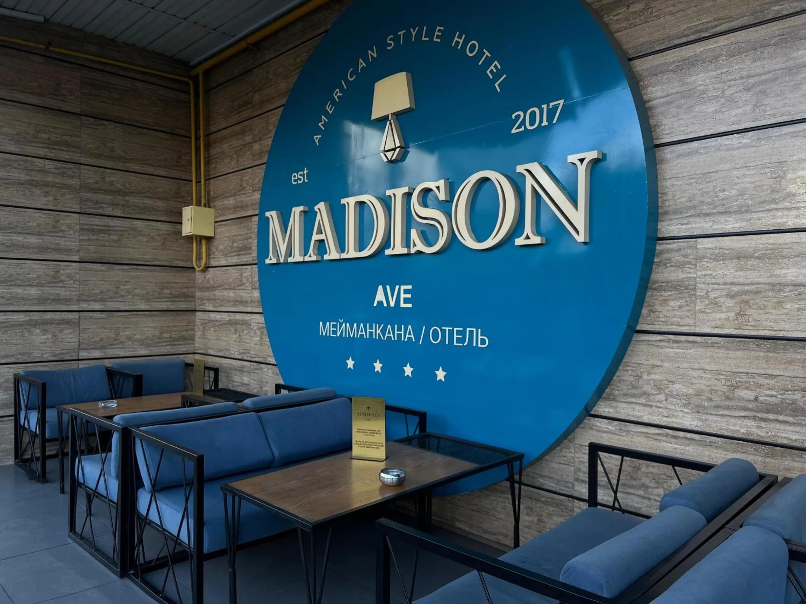 Property logo or sign in Madison Ave Hotel Bishkek