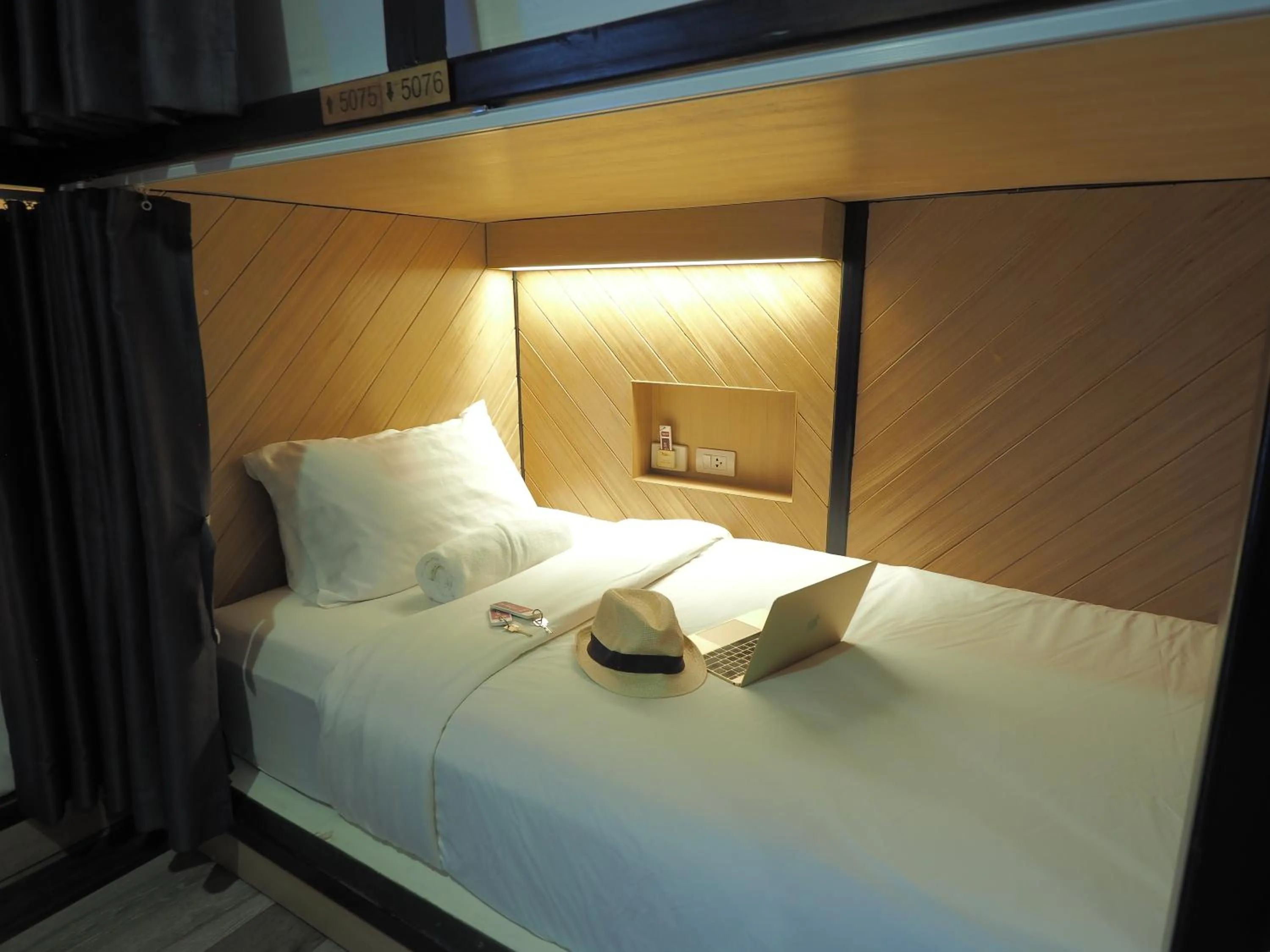 Bed in Alfresco Phuket Hotel