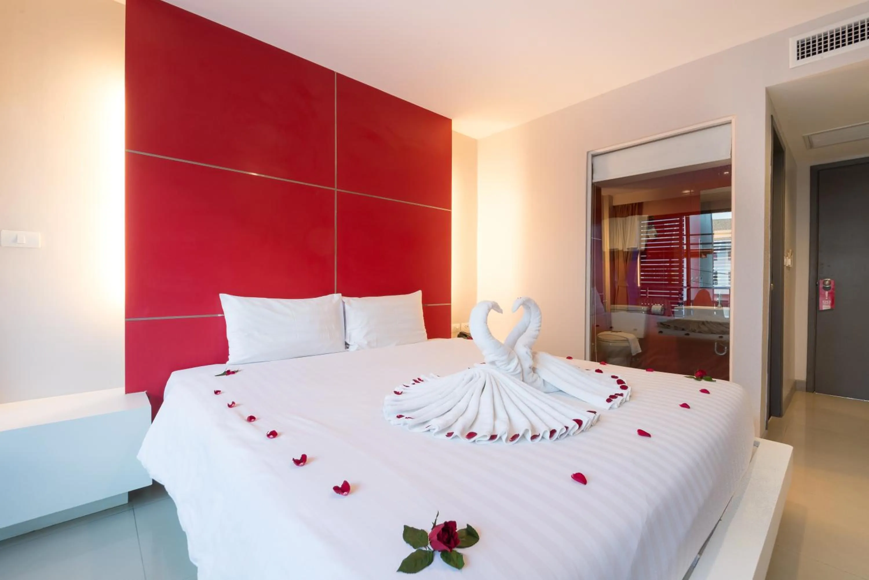 Bed in Alfresco Phuket Hotel