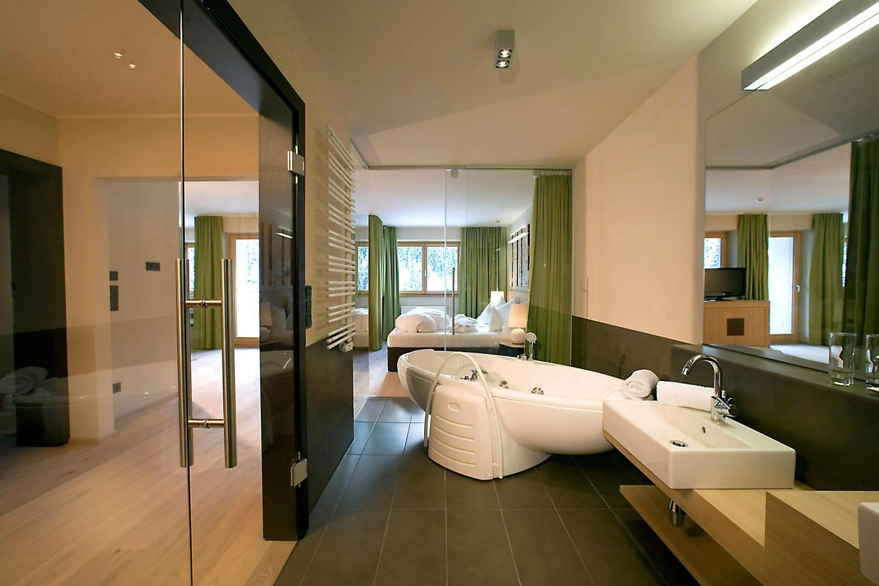 Bathroom, Bed in Almhof Family und Wellness Resort