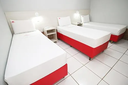 Bed in Hotel Pousada Bonsai