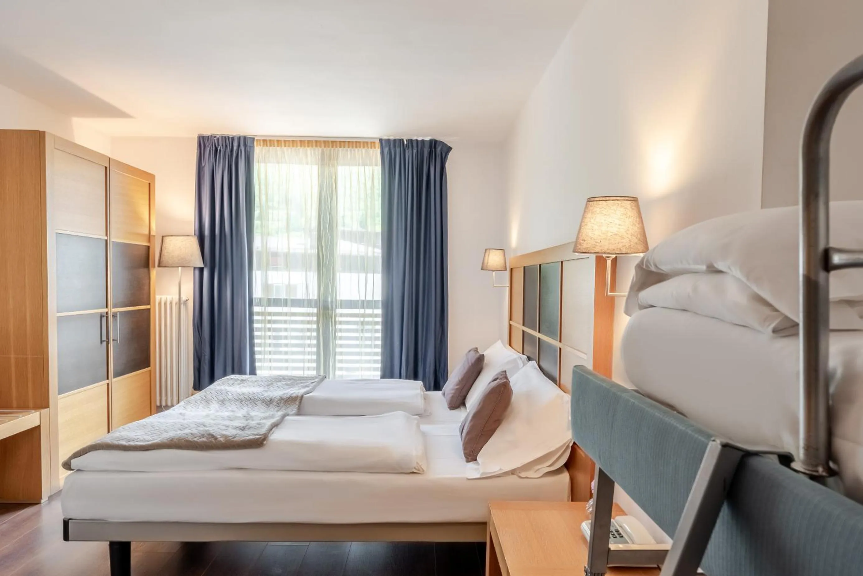 Bed in Hotel Dolomiti Chalet